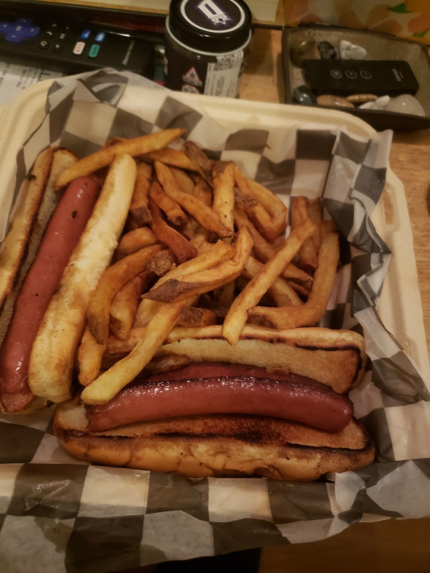 two plain hot dogs with a side of french fries