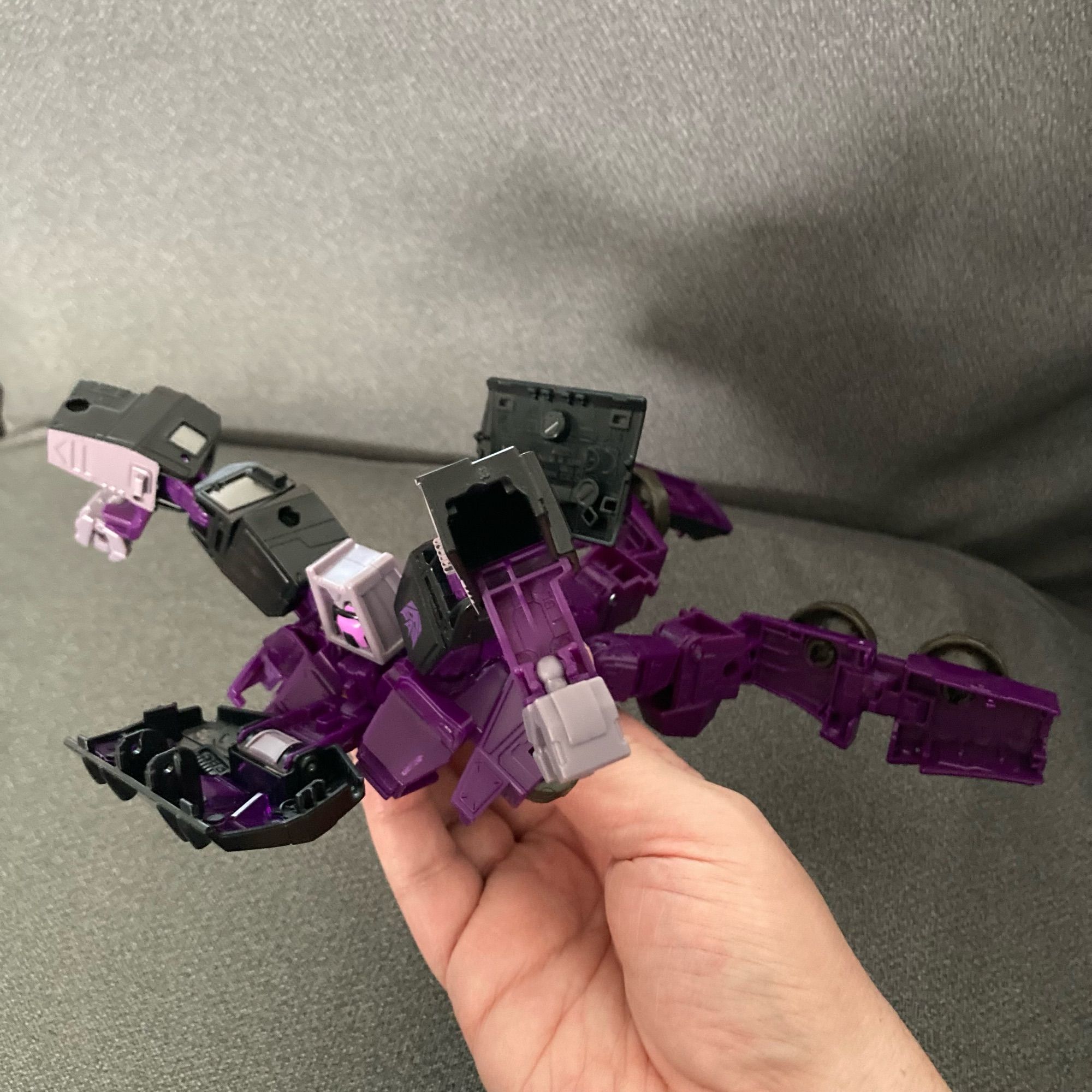 A splayed out Transformers Legacy Animated Motormaster