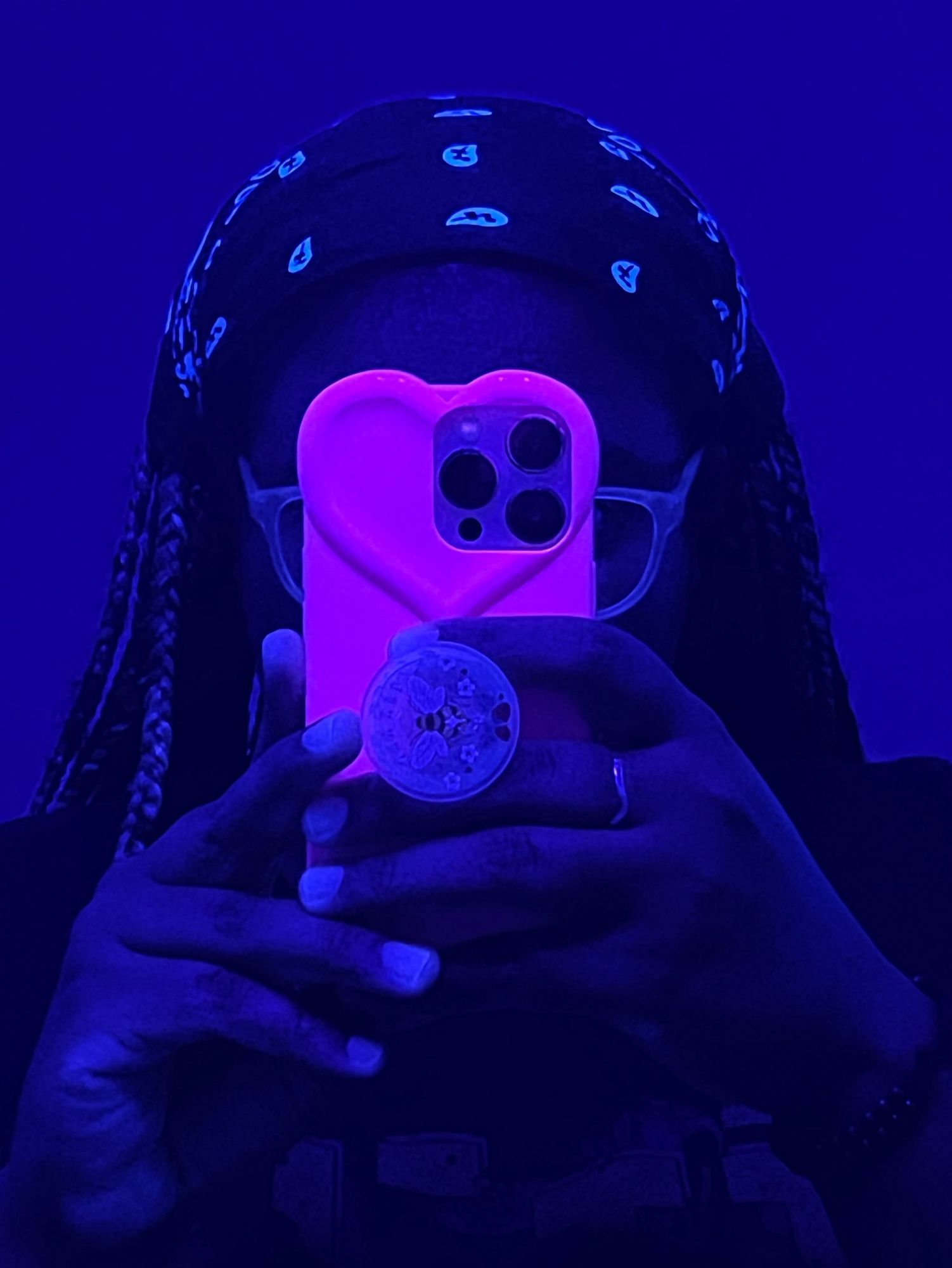 Mirror selfie of me with my heart shaped phone case in front of my face