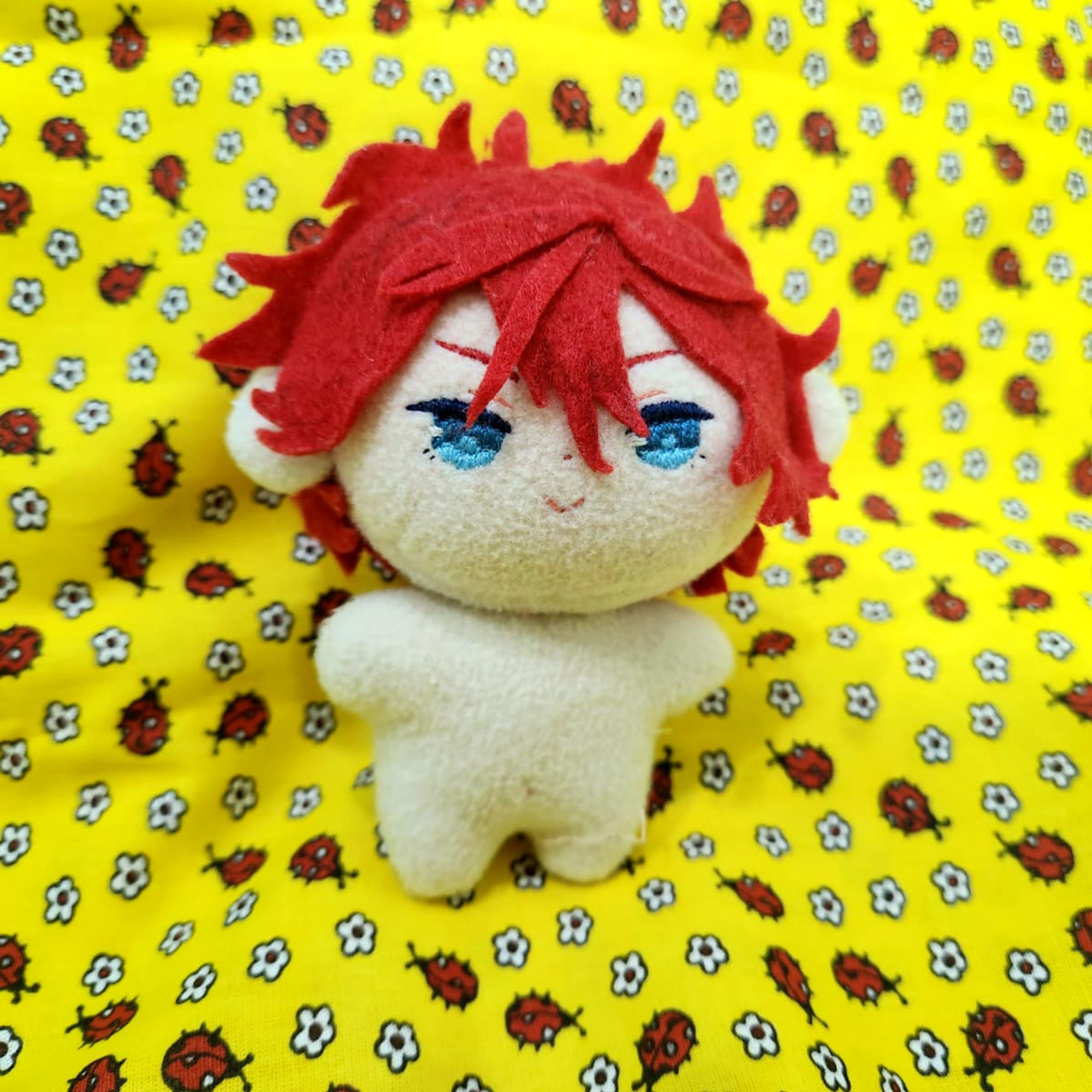 escandaloso!!! (plushie without the dress on a yellow ladybug pattern fabric)