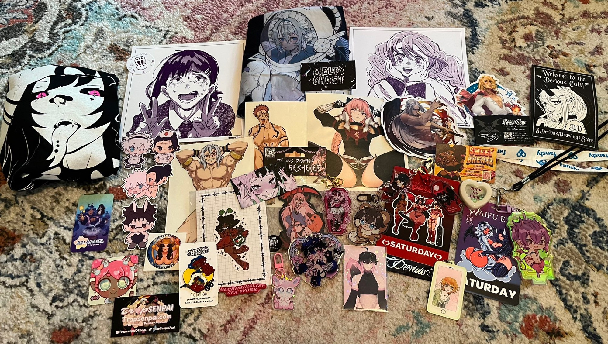 A haul of art (prints, pins, keychains, t-shirt) purchased from various artists at KimochiiCon