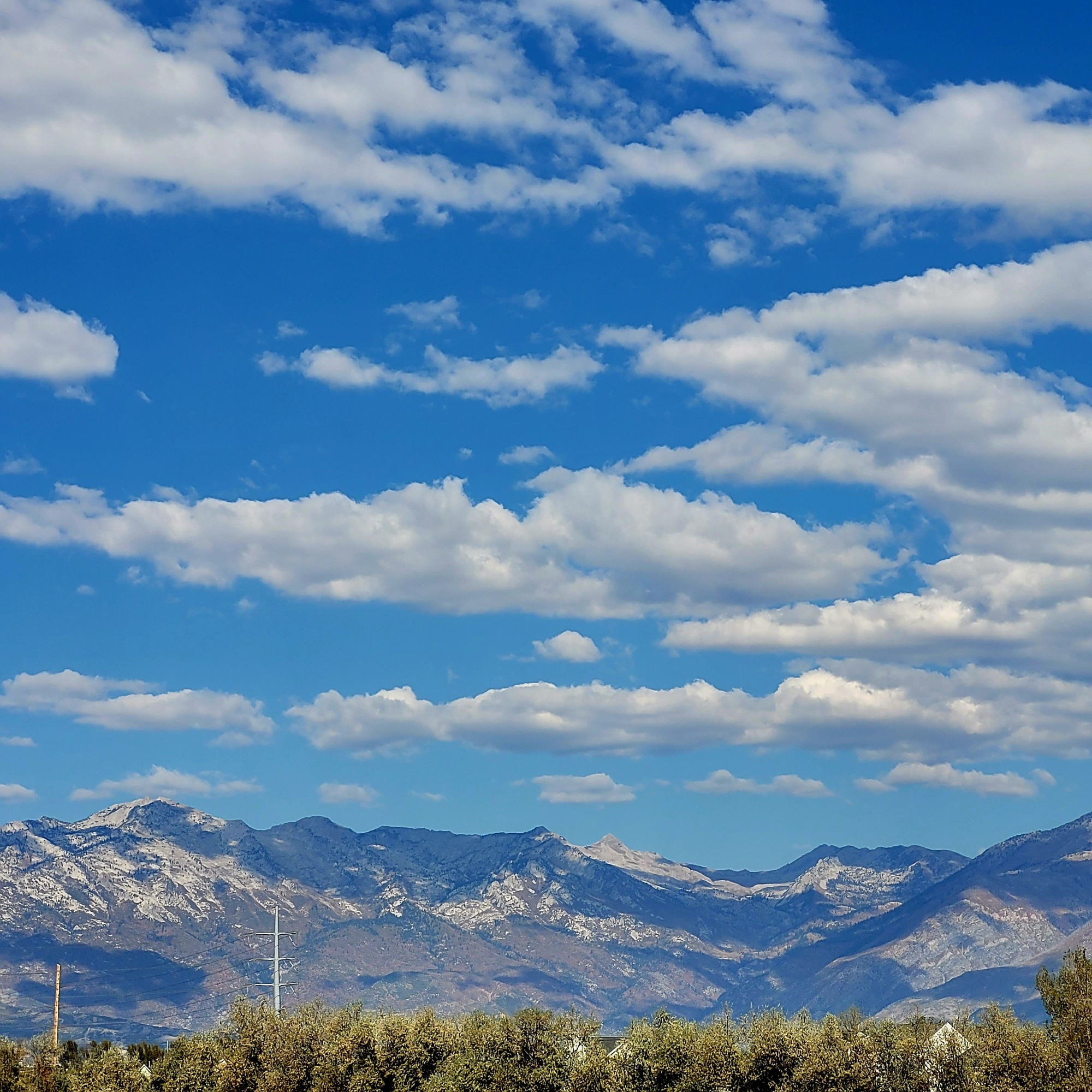 Mountains with blue sky and fluffy cloud ©AVM 2024 Utah Lake