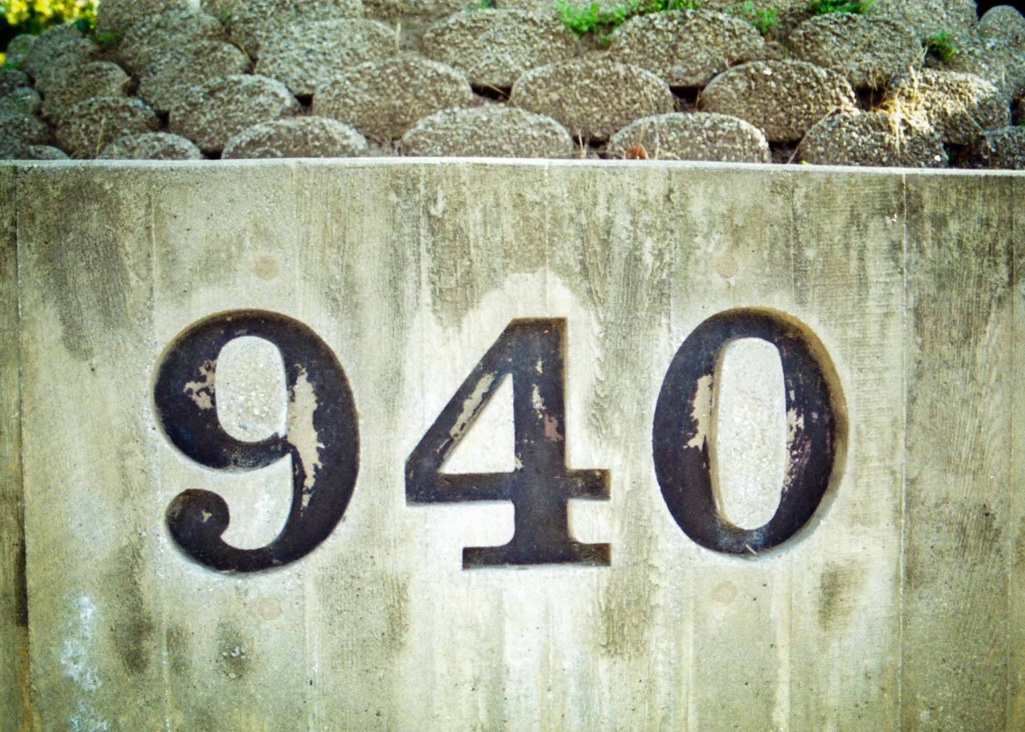 Number 940 stone carved sign Los Angeles, California – shot on film