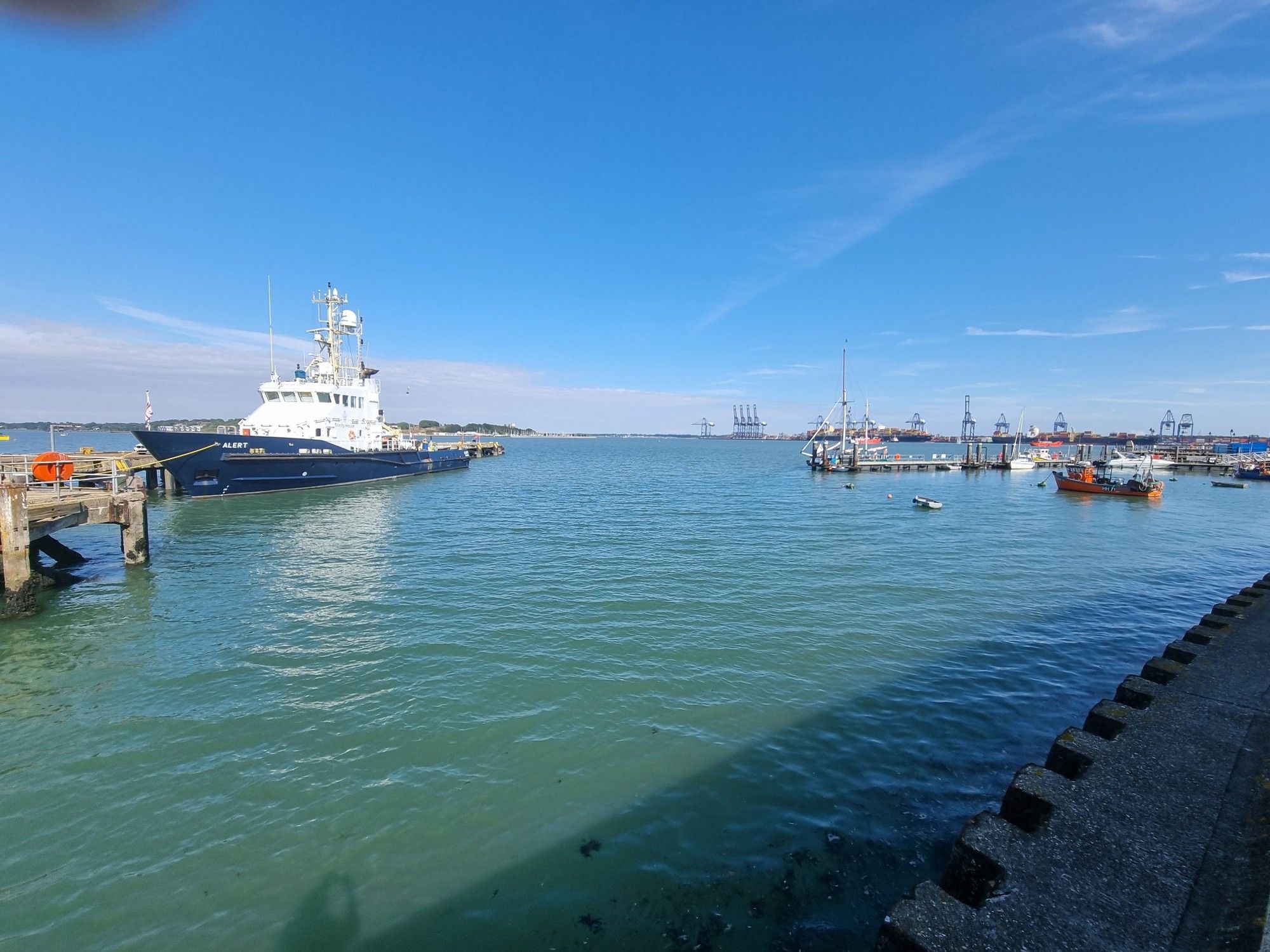 Harwich estuary. Trinity House tender vessel to the left. The Ha'Penny Pier is to the right and Felixstowe is centre right on the horizon