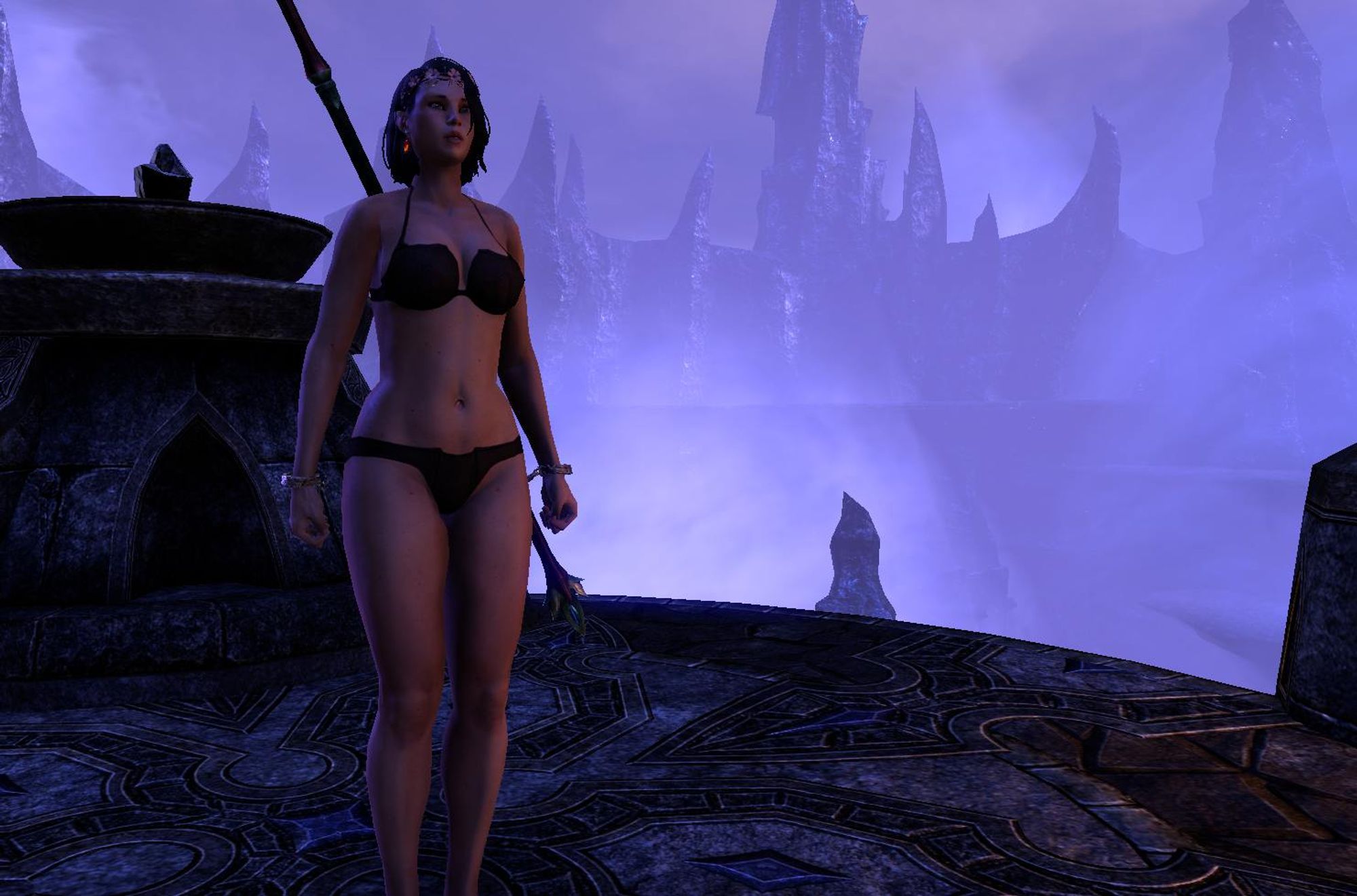 The same character as before, but now standing amidst a gloomy scene; a stone platform overlooking alien-looking spires in the distance, seen through a thick purple haze. The woman stands at attention in the center of the platform, as though anticipating some dark ritual.