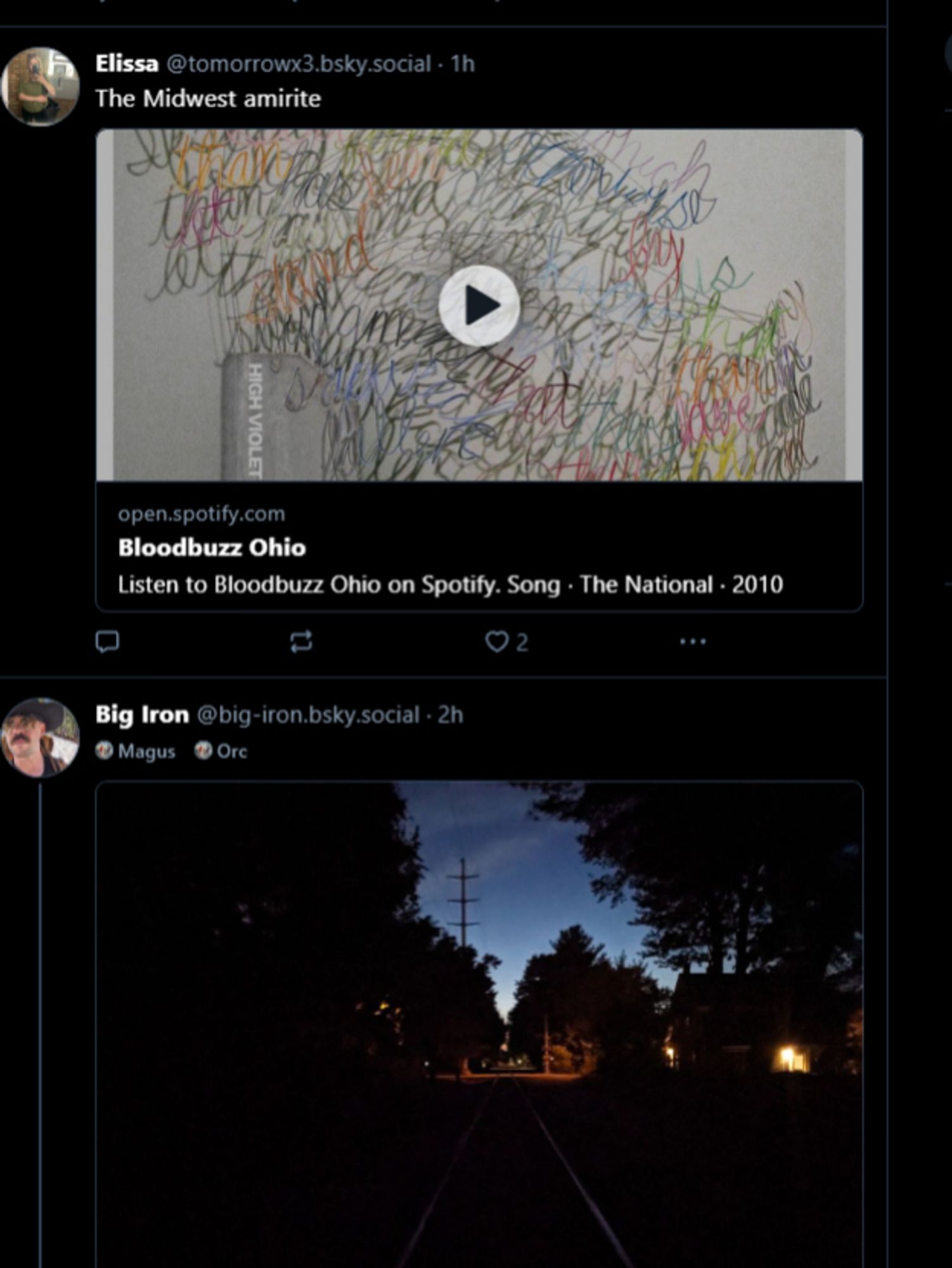 A bsky screenshot: one is a skeet that says "the midwest amirite" and a link to the National's Bloodbuzz Ohio; the second is a picture of traintracks at dusk taken, in fact, in the midwest.