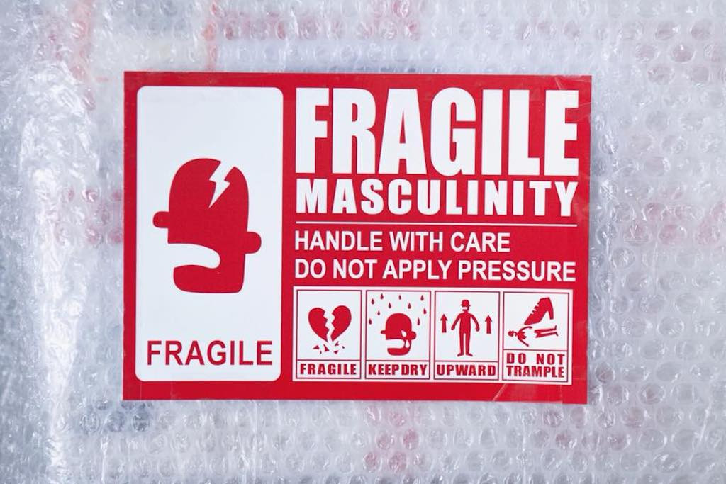 warning sign on bubble wrap "Fragile Masculinity, handle with care, do not apply pressure"