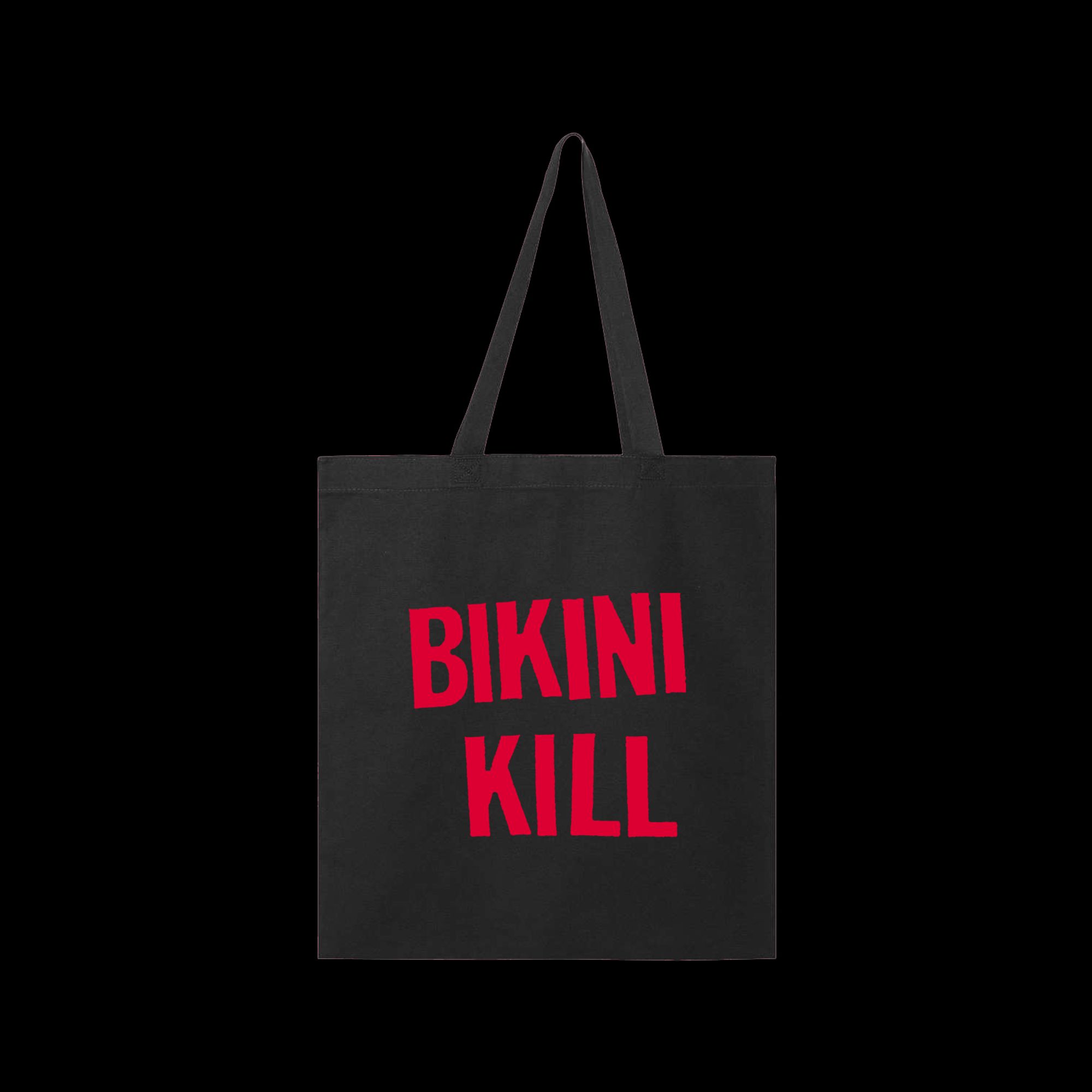 black tote bag with bright red lettering that says Bikini Kill.