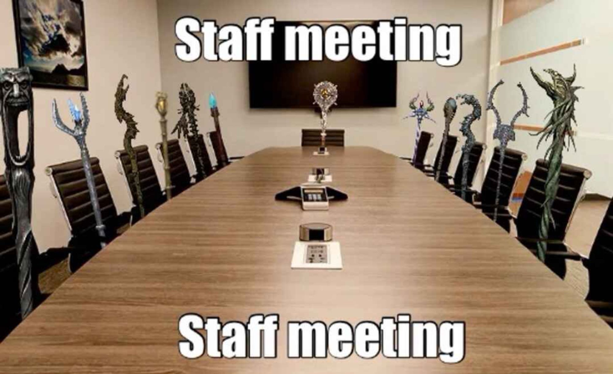 a big collection af magical staffs from video games arranged around a conference table.

Top text: Staff meeting

Bottom text: Staff meeting