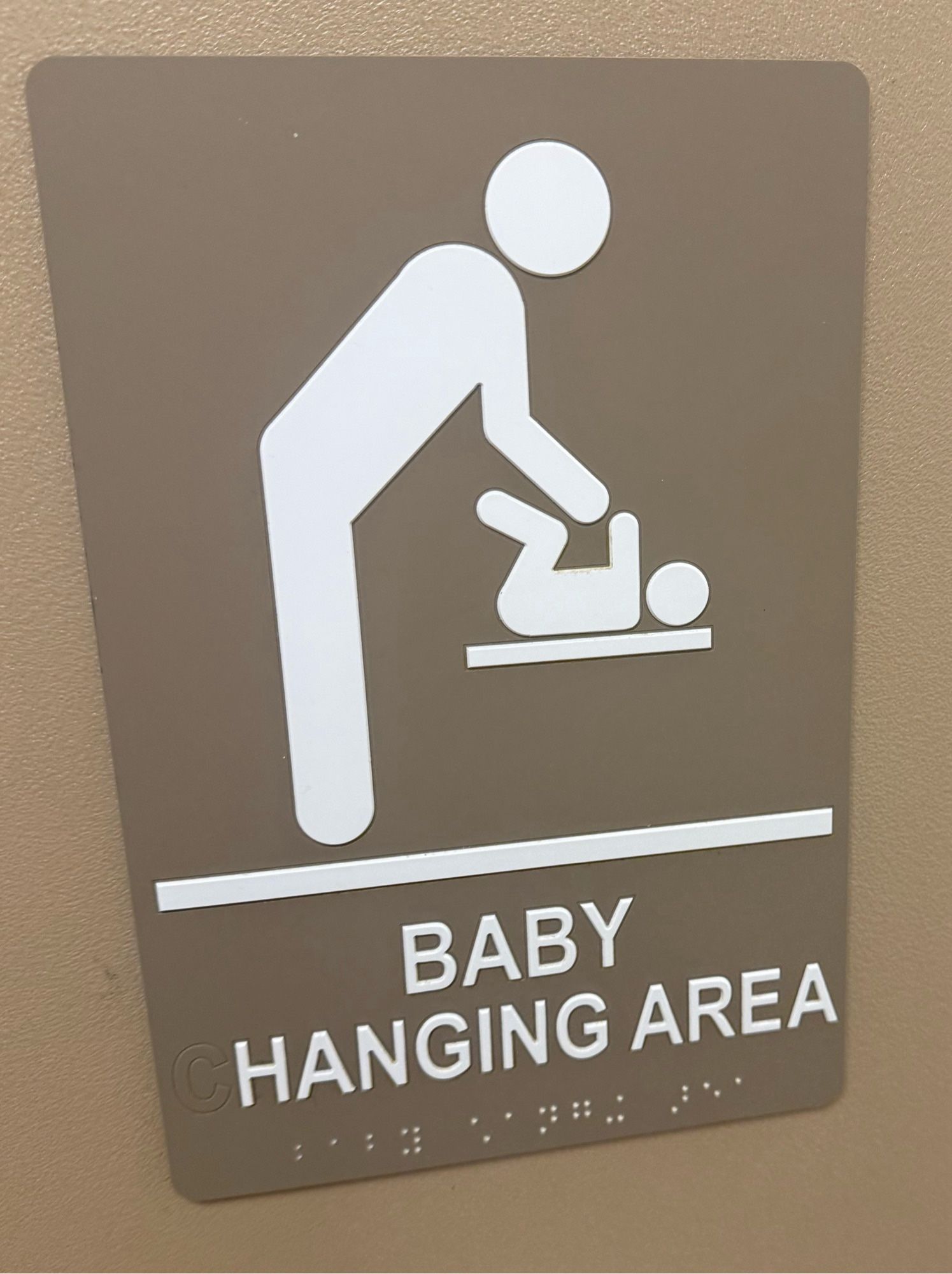 A sign that says “baby hanging area” at my barnes and noble bathroom.