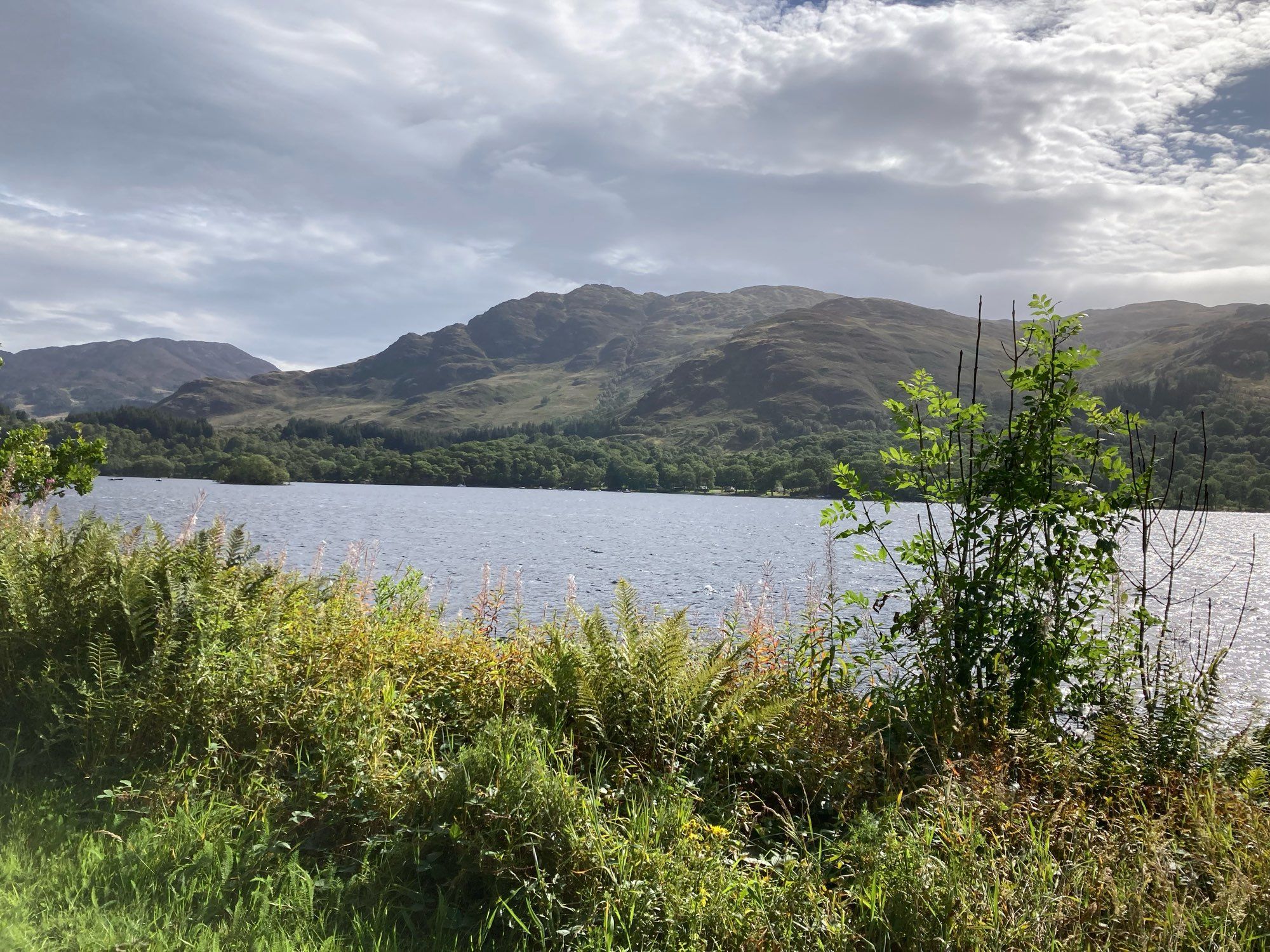 Looking across loch to rugged hills.