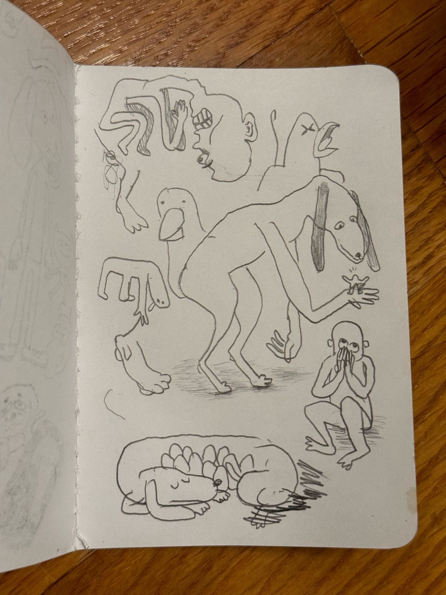 A sketchbook page of pencil sketches. A curled up figure praying, an angry bird crying out, a leg, a silly parrot, a dog beast with a tiny guy in its hand, a figure bending over, a foot, a figure sitting on their butt with their hand covering their mouth, HAL Laboratory Dog Eggs from memory