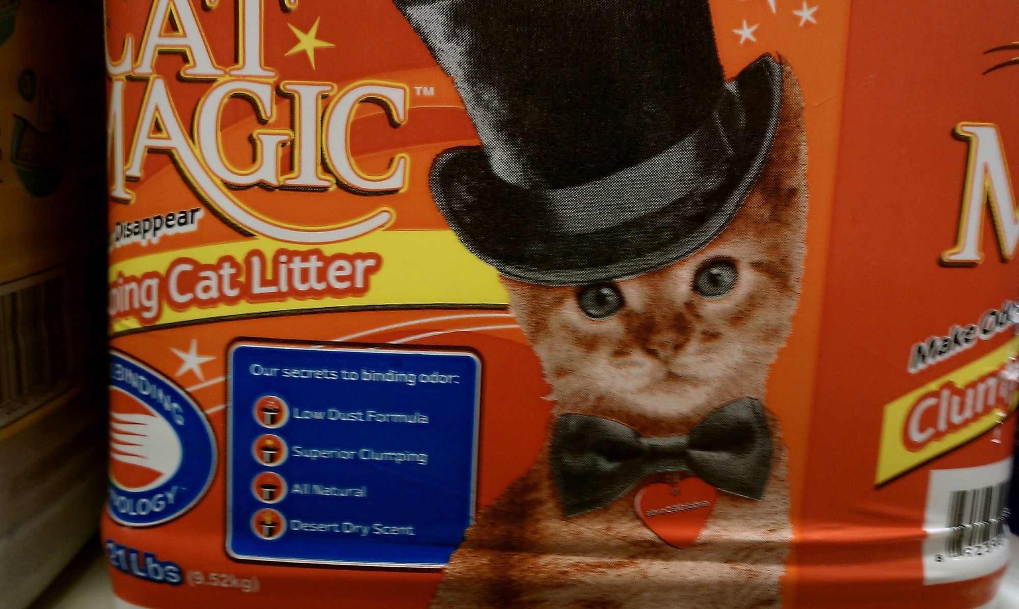 A picture of an orange kitten wearing a magicians top hat and bowtie on the side of Cat Magic cat litter.