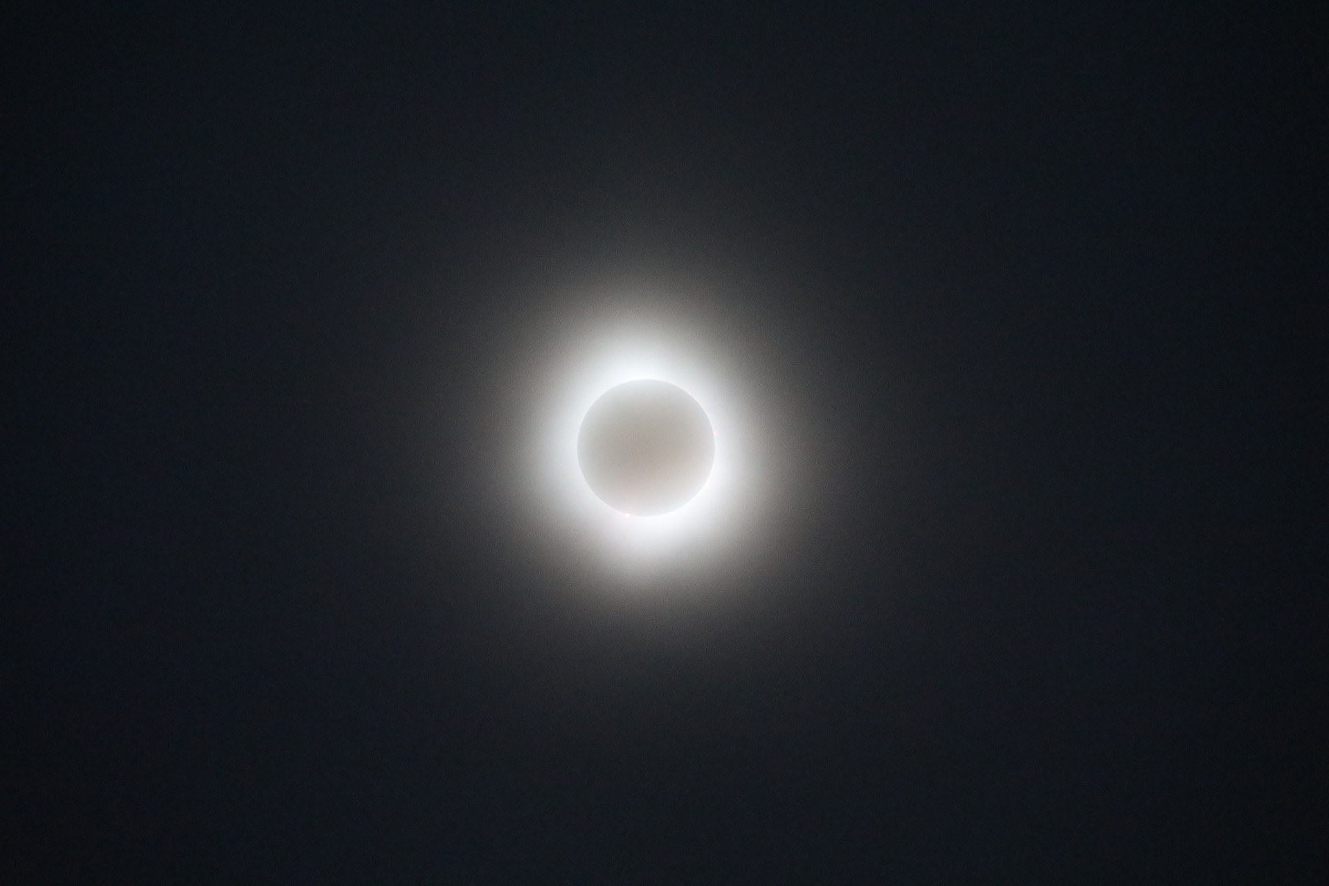 Picture of the solar eclipse in overcast. Shot with a Canon 5D Mark IV with a 70-200 f/2.8 lens with a 2x extender.