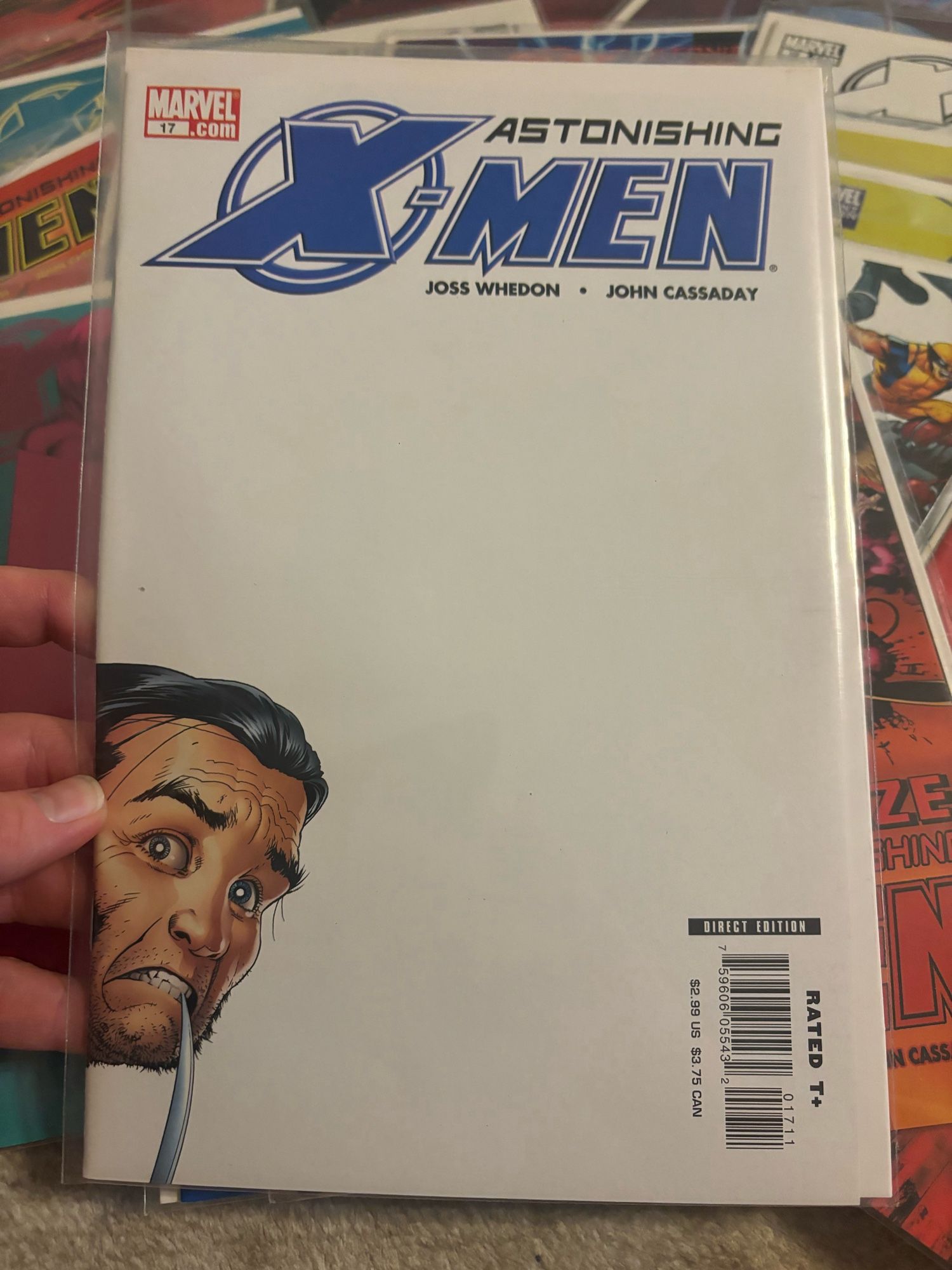 Astonishing X-men 17. A timid Wolverine peaks out from the corner of this cover. Such a damn great use of negative space