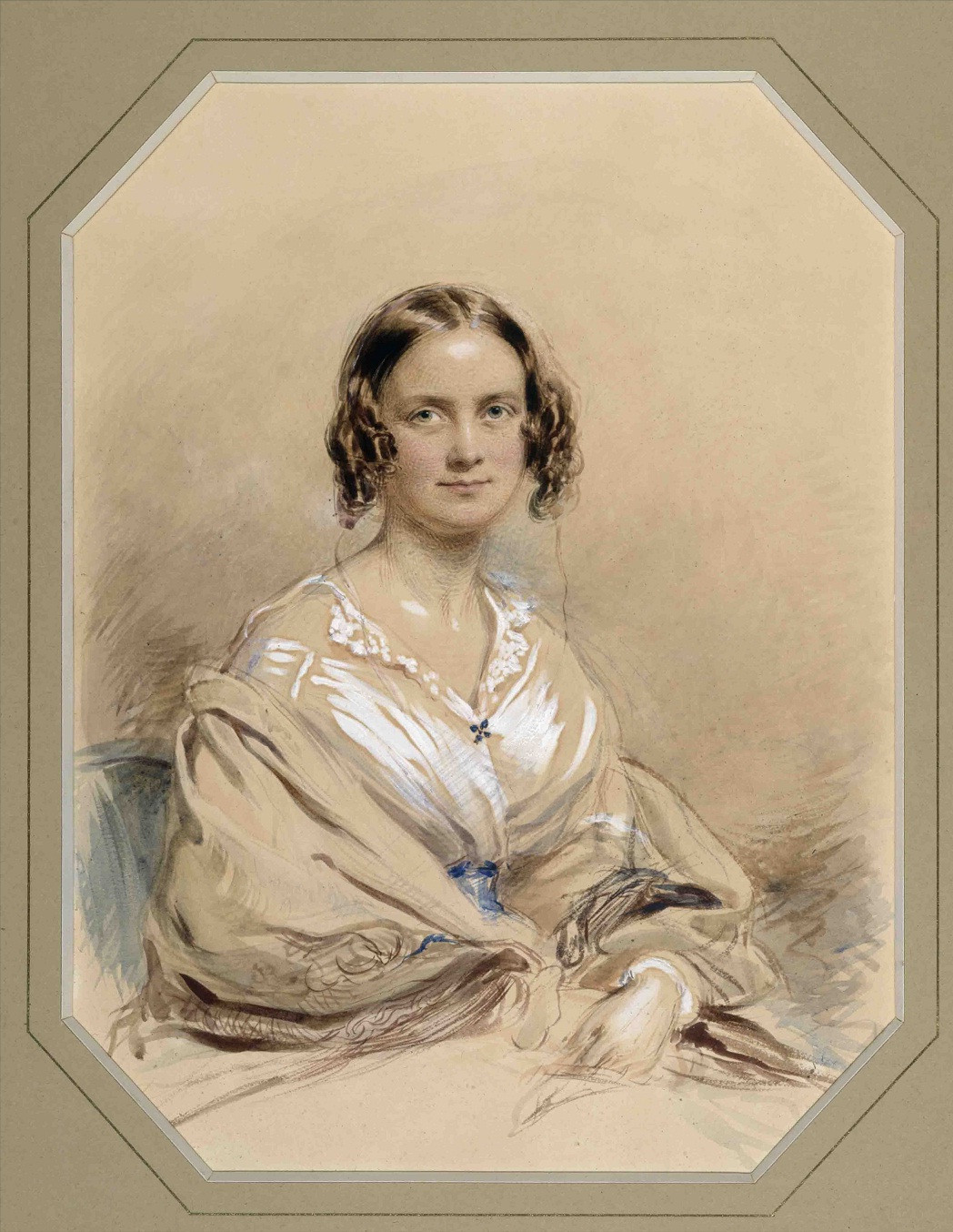 A pastel portrait of Emma Darwin in 1840. She is young, looking at the artist, wearing a white blouse.