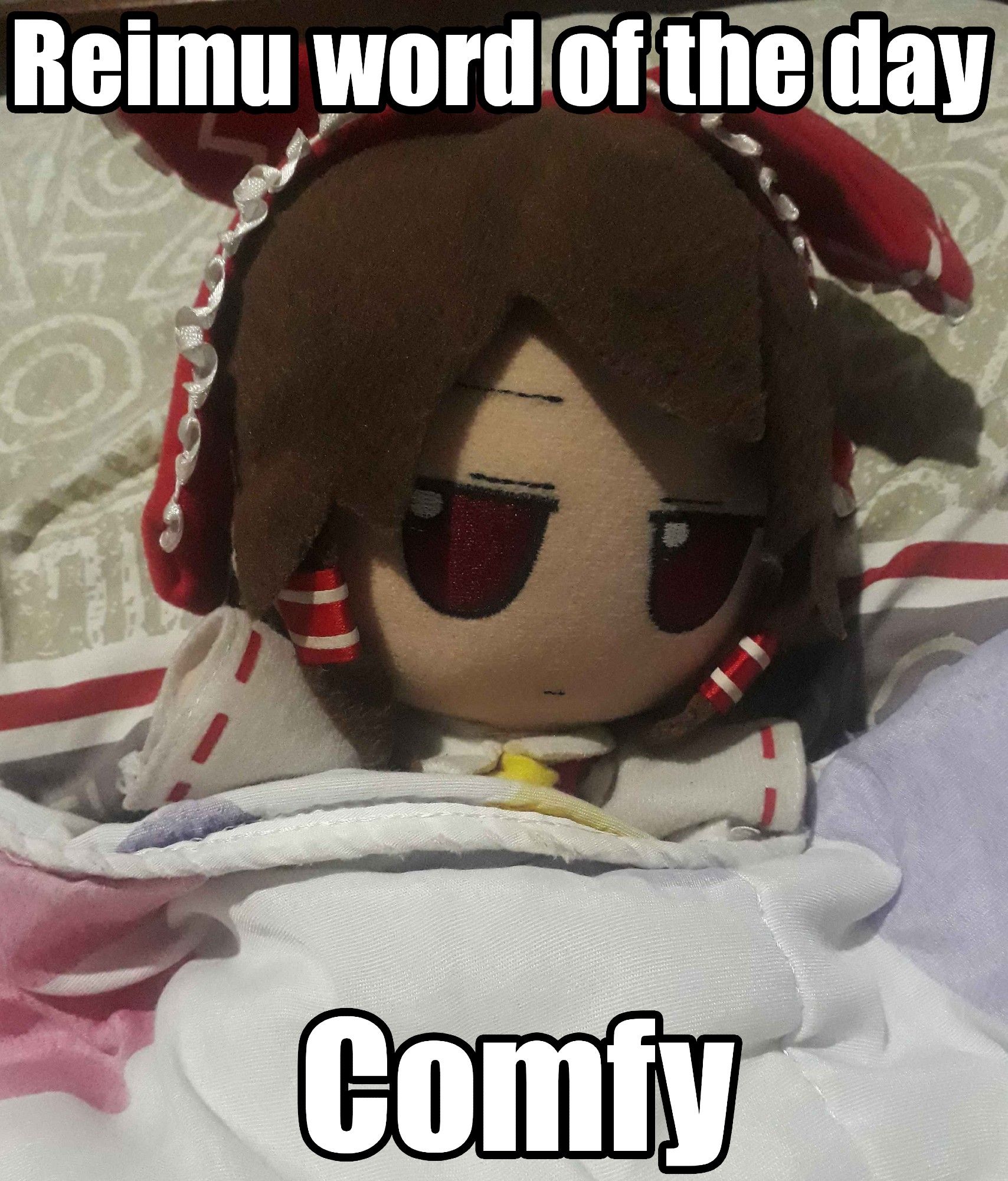 Reimu Hakurei fumo lying on a bed, with her head on top of a gray pillow and she is covered in a white duvet with a flower print