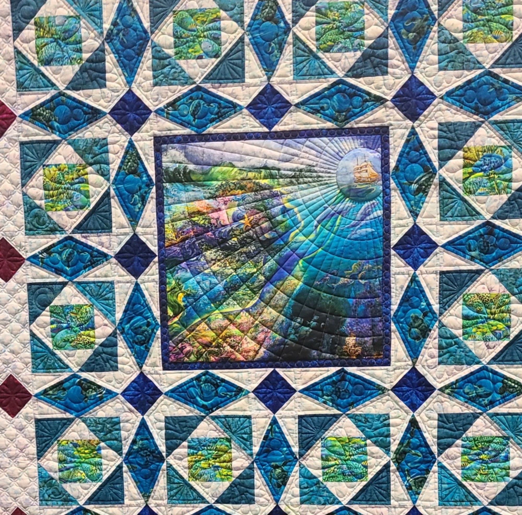 I like the circles quilted in the blue diamonds. I reminds me of rolling waves.