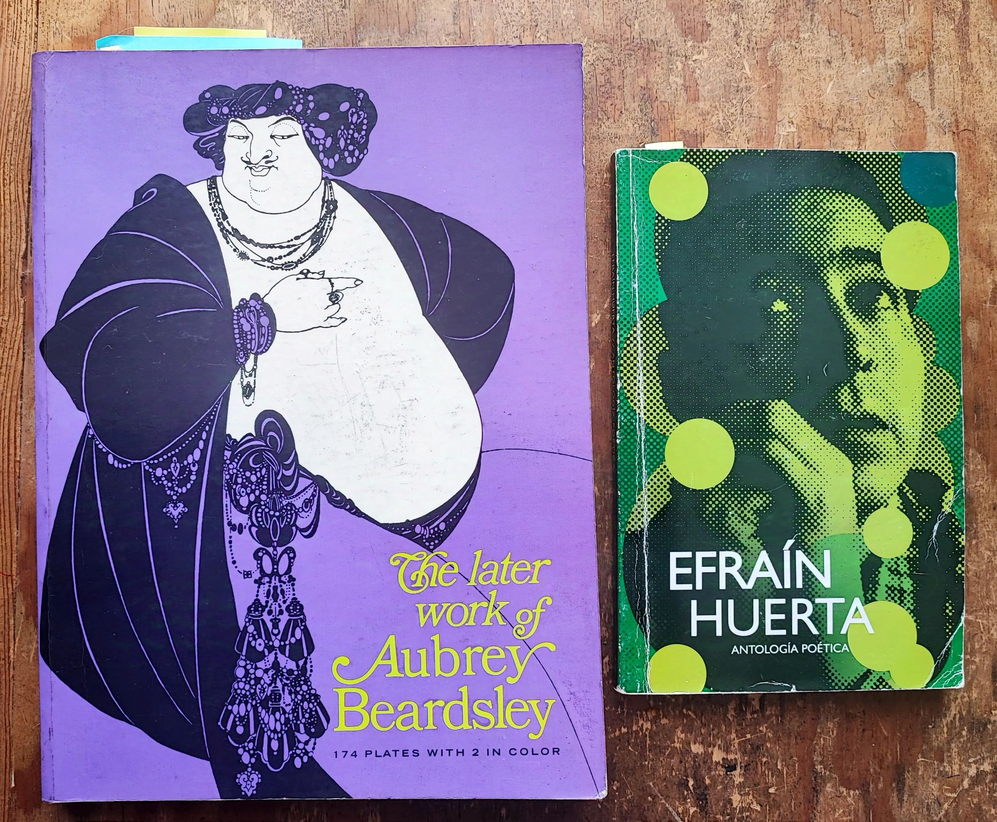 covers of books on Aubrey Beardsley (purple) and by Efrain Huerta (greens)