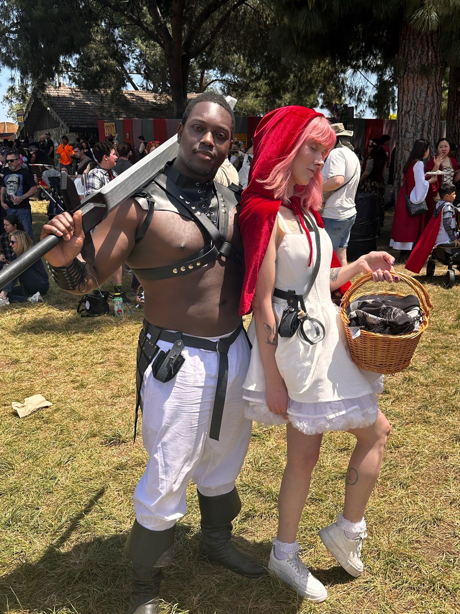 Ify and Em posing at the Renn Faire. Em has a lil red riding hood thing going on.