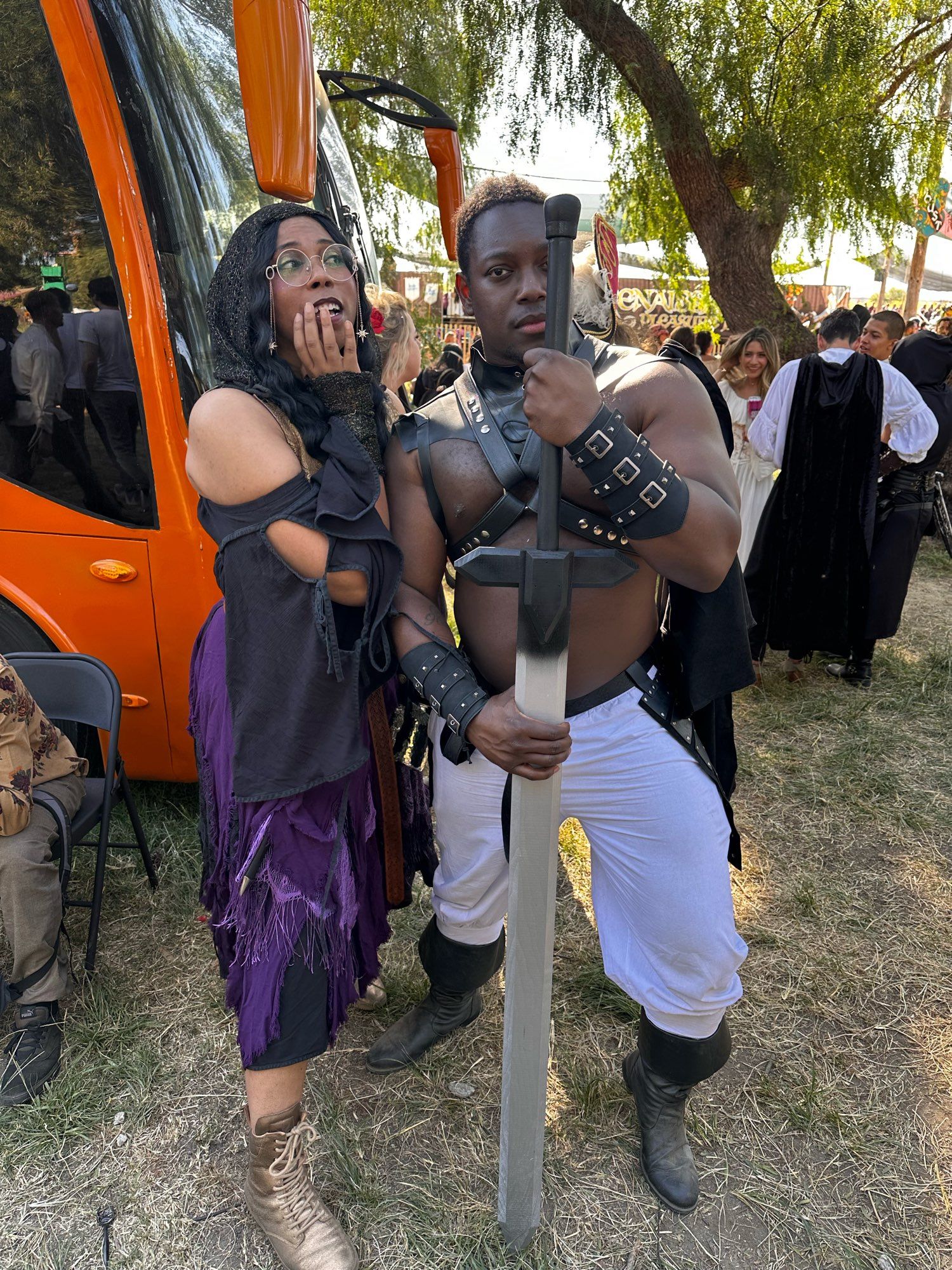 Ify and Aabria posing at the Renn Faire they’re dressed up.