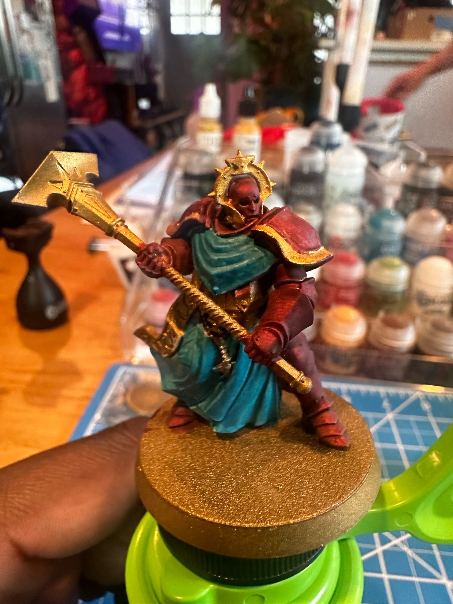 A stormcast sequitor miniature painted in Astral Templar (purple and teal-ish blue) colors