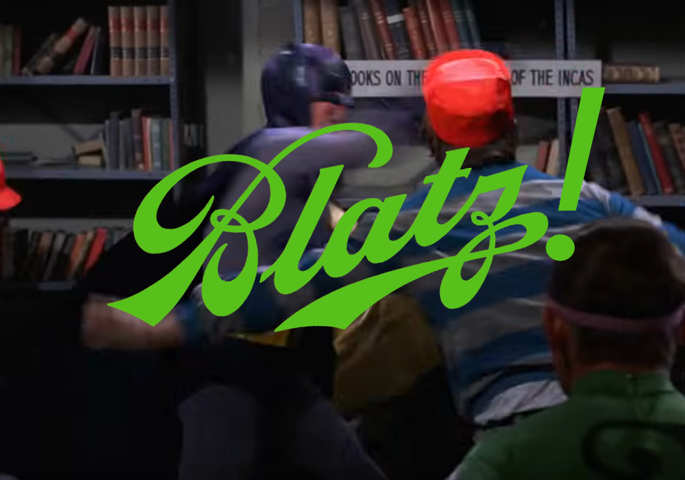 Batman punching some henchman in a blue and grey striped shirt in front of a shelf of books about the Incas with the word "Blatz!" in bright green at a jaunty angle