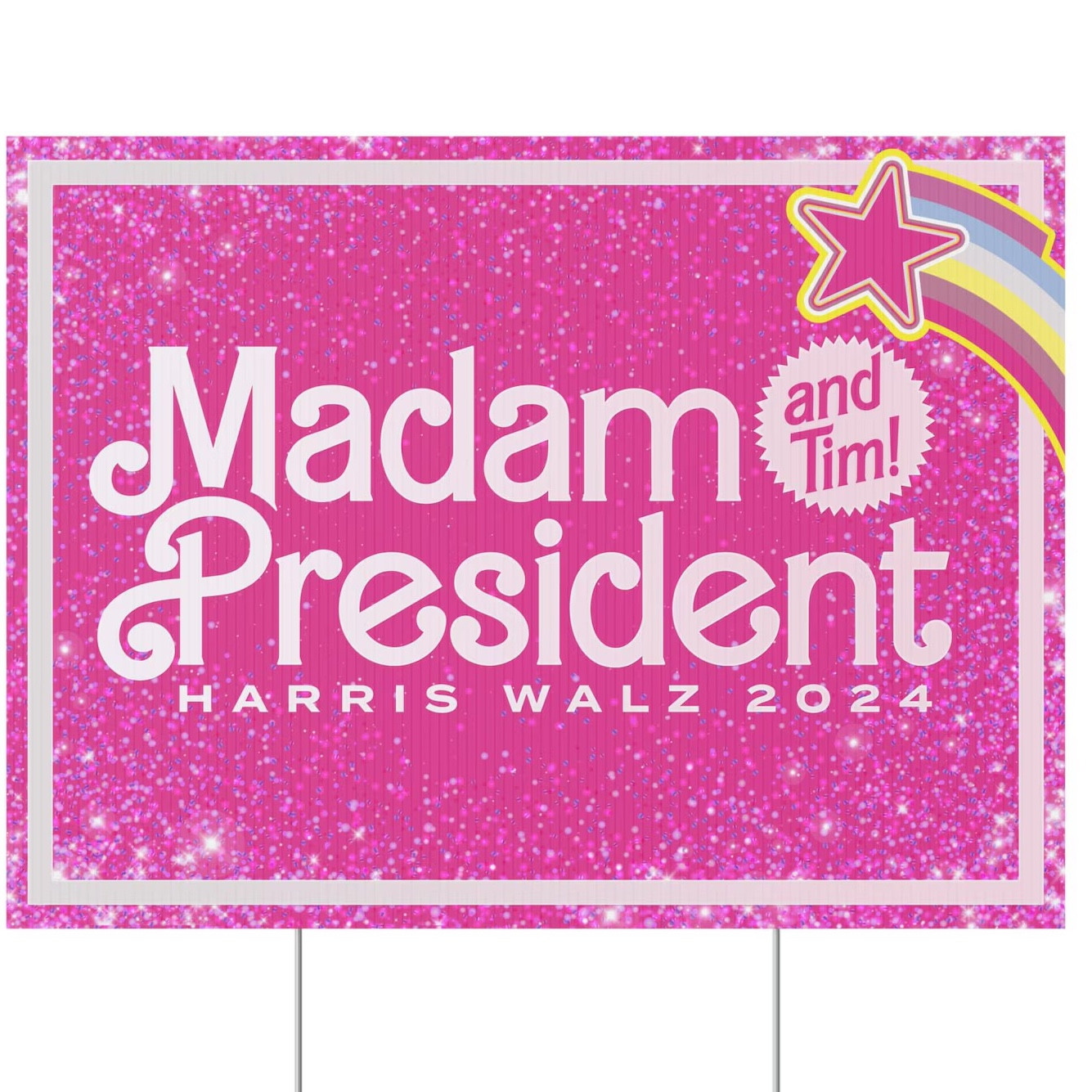 A pink and very sparkly political sign. It says “Madam President“ in Barbie font, and there’s a shooting star and a little seal next to that with the words “and Tim!“ inside it.

Underneath, in unobtrusive letters, it says “Harris Walz 2024”