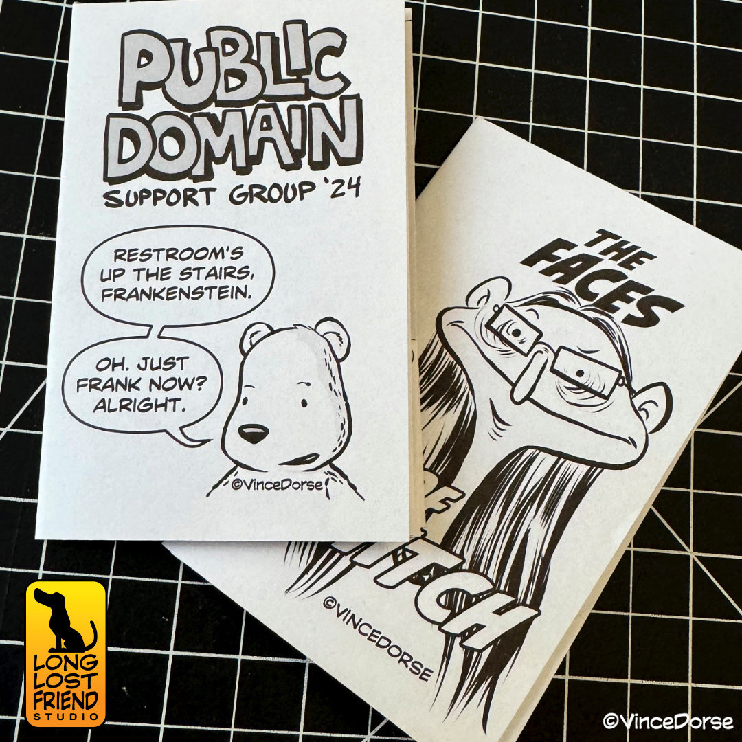 two mini-comics lying on a cutting board.