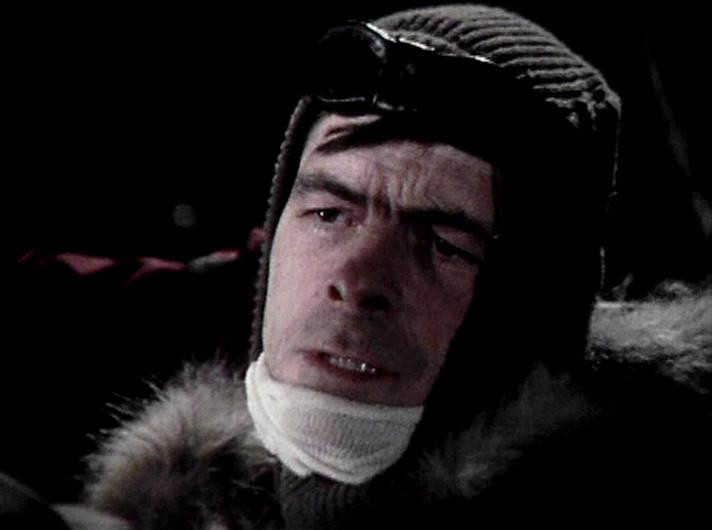 

ChatGPT4 describes the image as: "The image shows a man wearing cold-weather gear, including a knitted hat, goggles on his forehead, and a thick fur-lined coat. His expression seems serious or contemplative, and he's wearing a scarf or bandage around his neck. The dark background suggests that the setting might be outdoors or in dim lighting, possibly portraying a scene from an adventurous or historical context, like an Arctic or mountain expedition. This attire and expression typically suggest resilience in harsh conditions."

Blakes7Bot, version 3.7.31. Upload retries: 0. bluesky.py version: 3.12