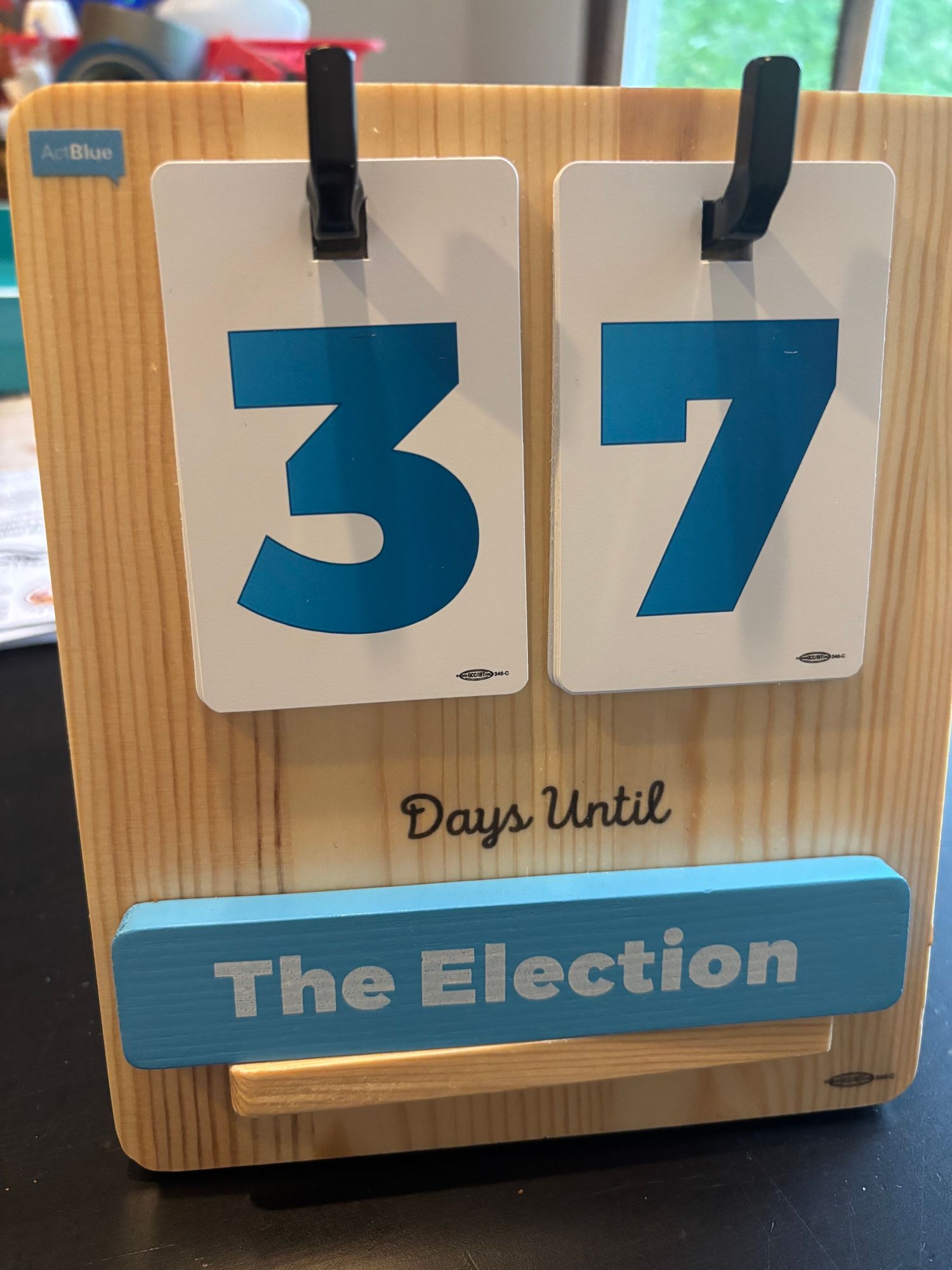 A wooden countdown calendar reads "37 Days Until The Election.