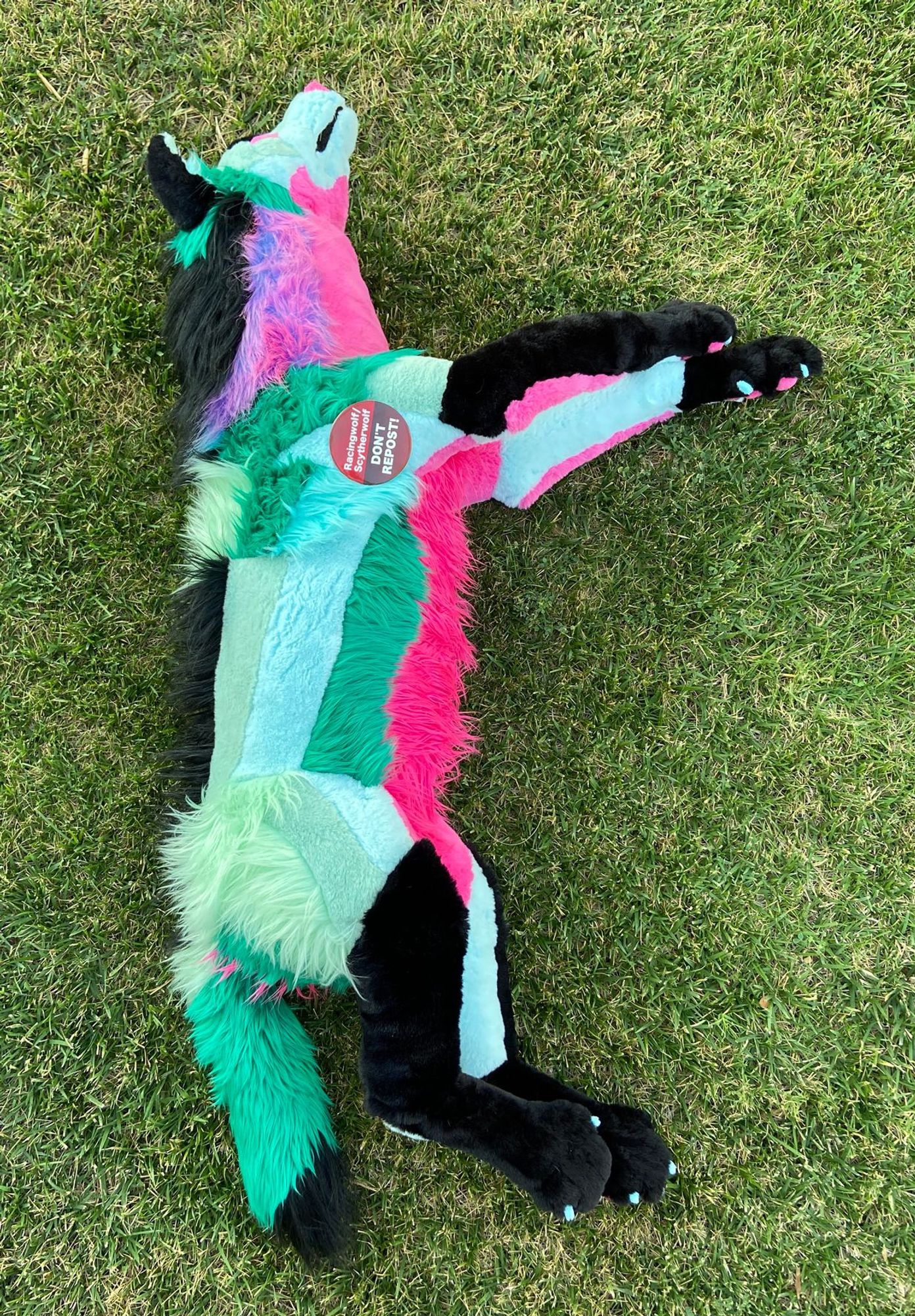 Sparklewolf plush lying on side