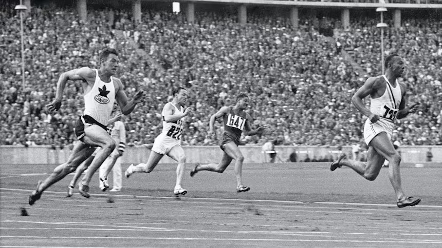 Jesse Owens on his way to winning 200m gold at the 1936 Berlin Olympics