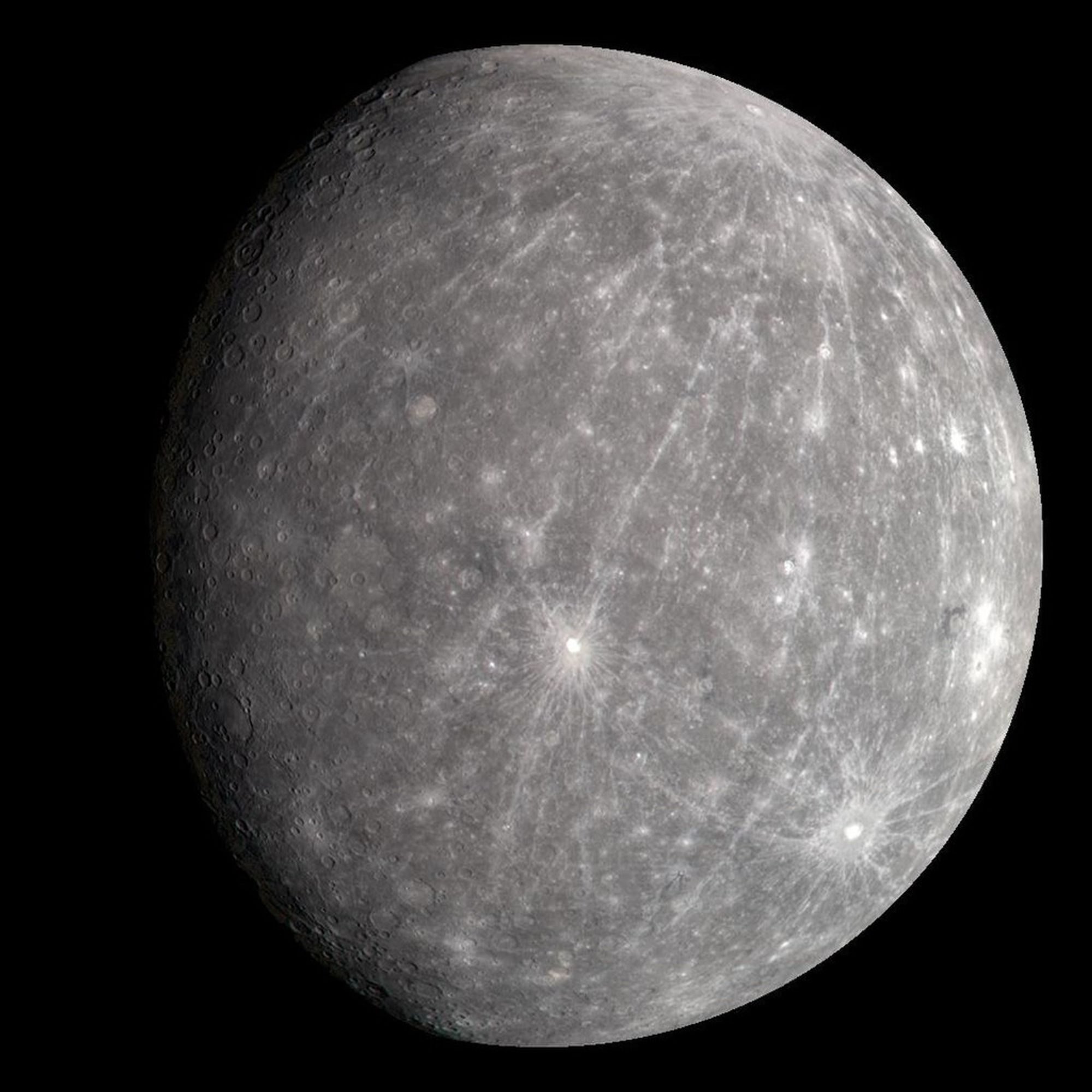 Mercury as imaged by MESSENGER. The planet is gray and heavily cratered, and resembles Earth’s moon