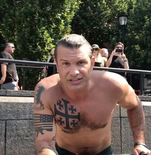 Drunk neonazi pete kegsbreath shows off his white nationalist tattoos staring into a camera poolside