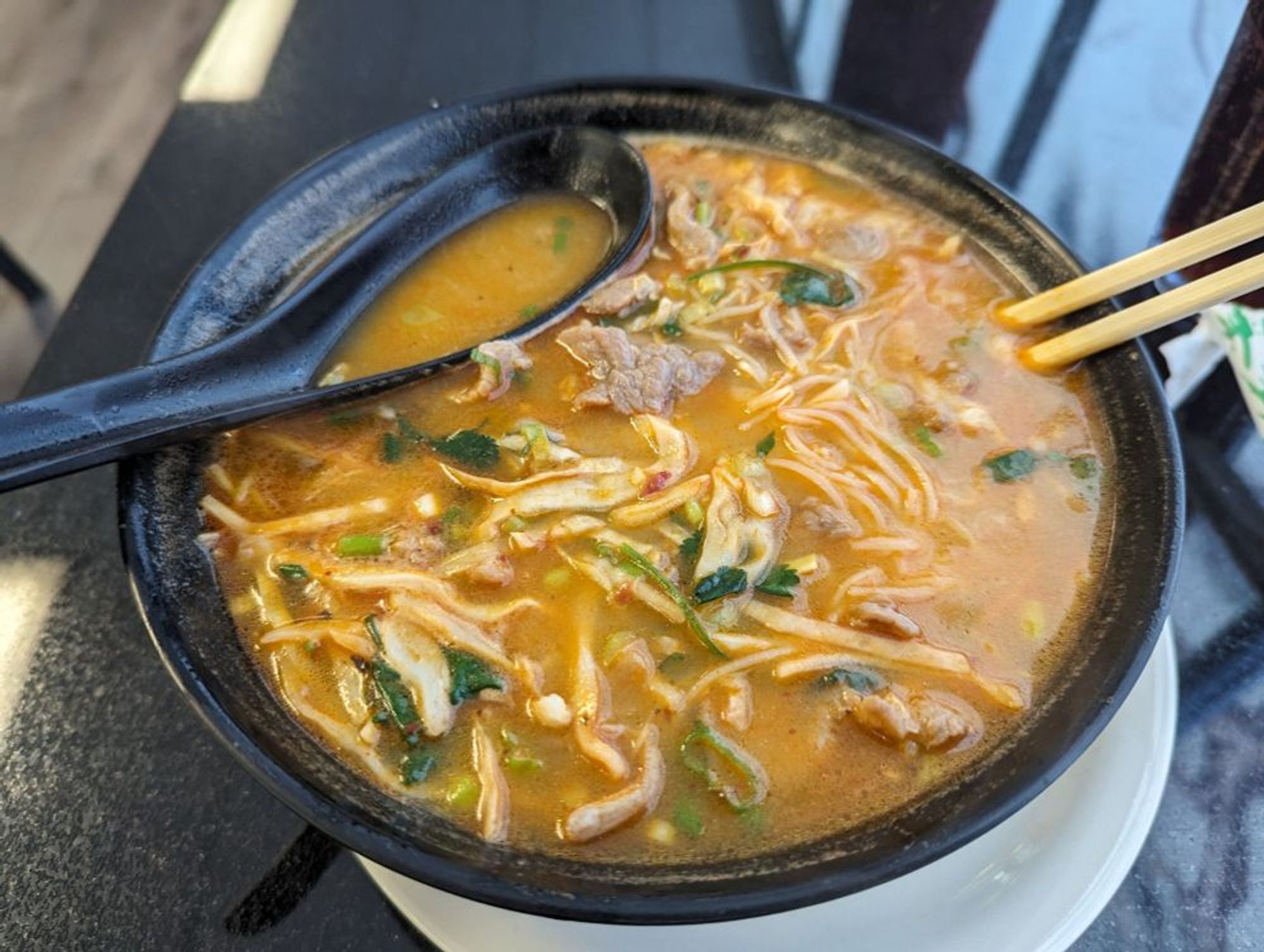 bowl of sichuan beef noodle soup from Zoe's Noodle House, $13.99