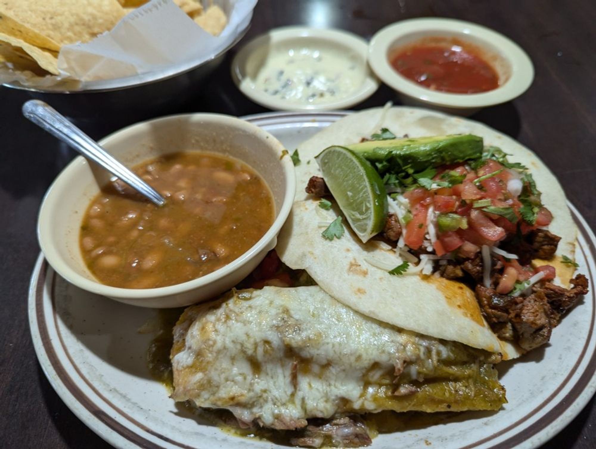 taco al carbon, tamal, frijoles borrachos with espinaca dip and salsa and chips. $12.99 at El Potro