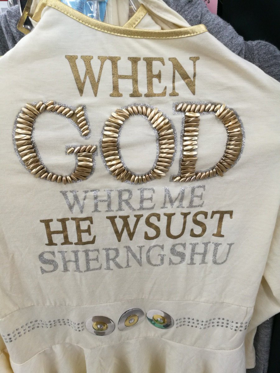 a garment (shirt?) reading:
WHEN
GOD
WHRE ME
HE WSUST
SHERNGSHU