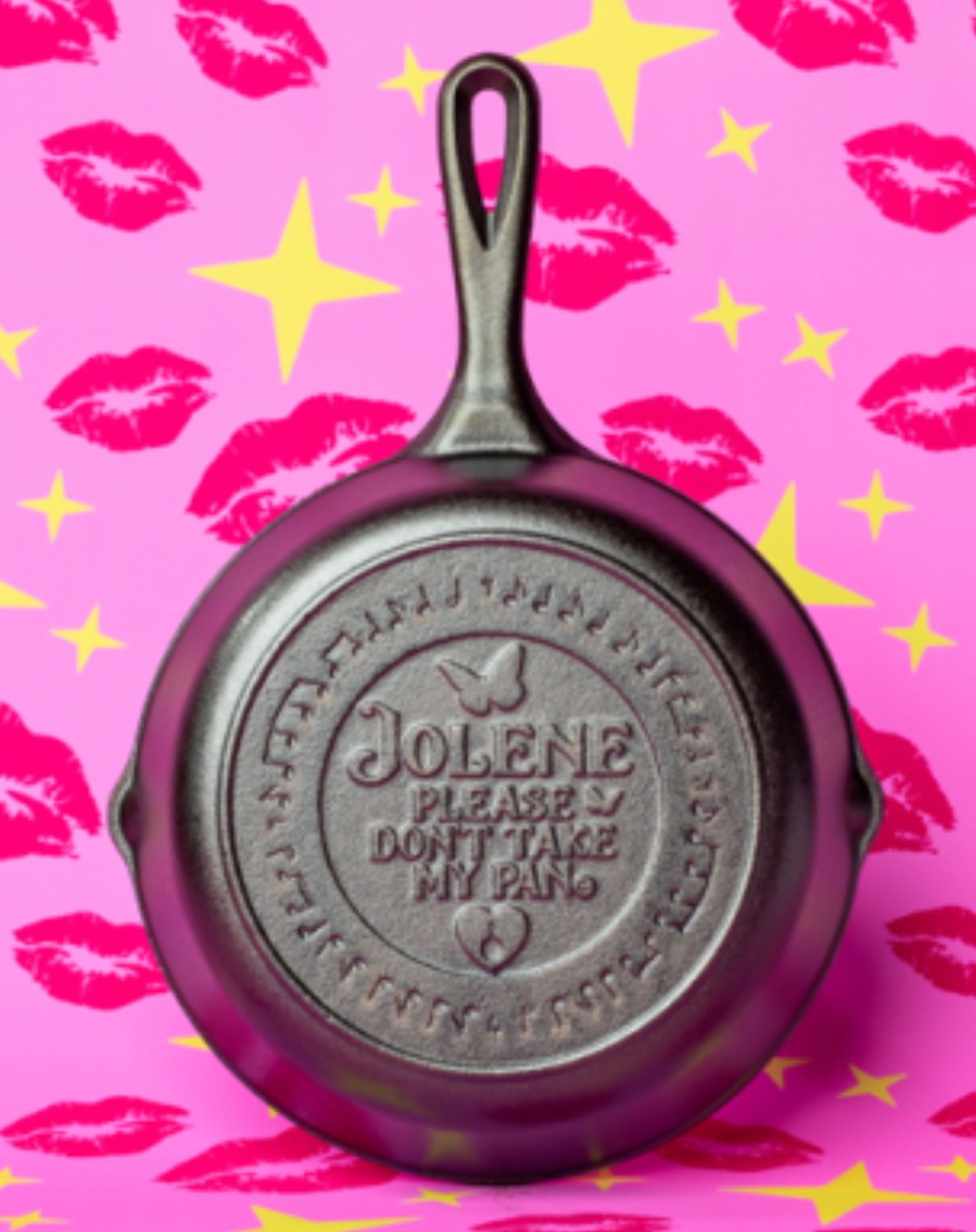 Photo of an 8 inch cast-iron pan the bottom of which is impressed the words Jolene please don’t take my pan