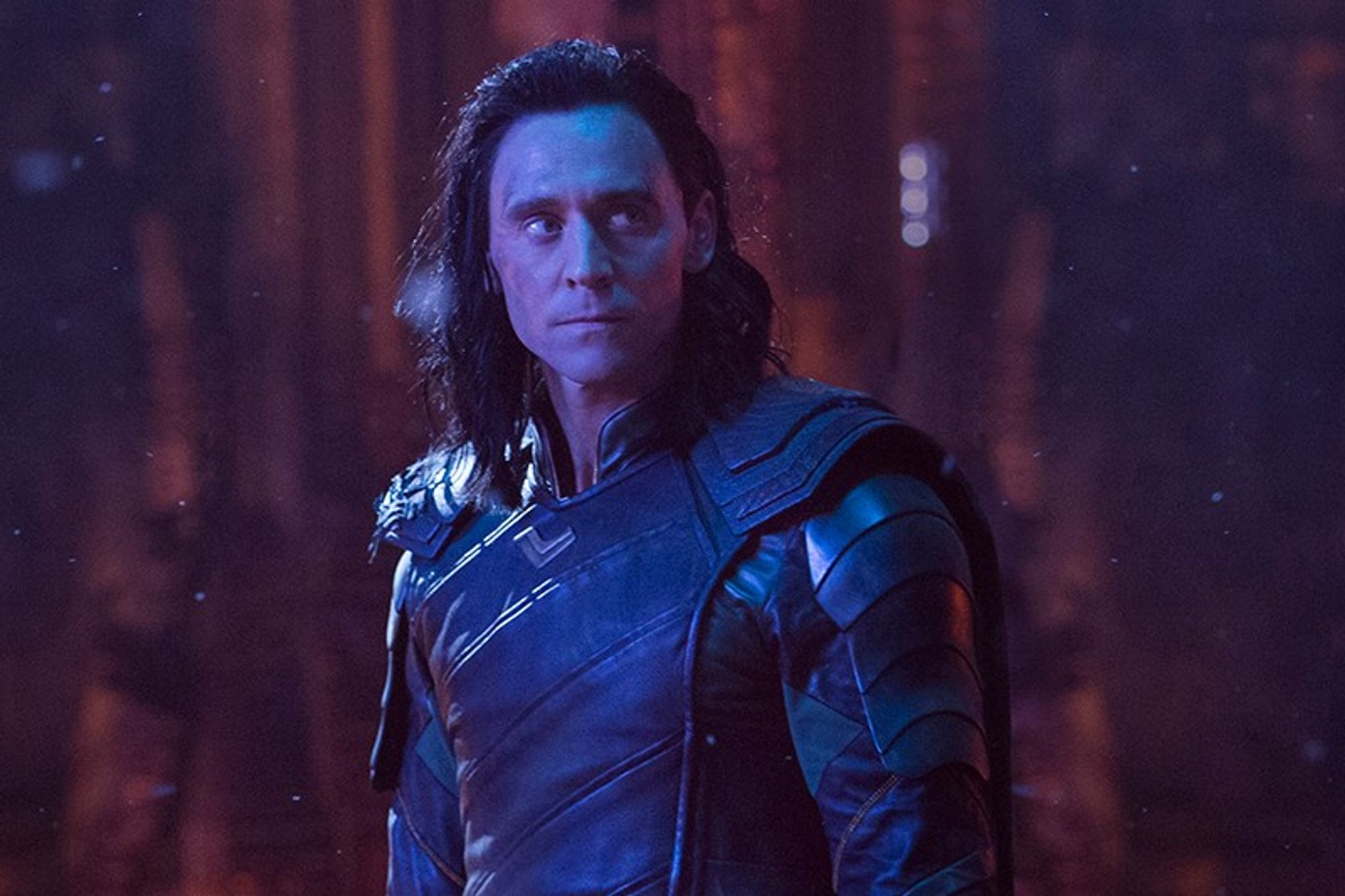 Loki, lit up in blue-purple lighting, with slightly messed up hair, looking off screen like he's planning something. Something which, if this is the scene I think it is, turns out to be quite unwise.