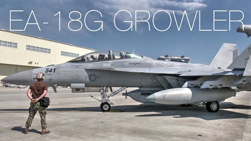 An E/A-18G Growler, carrying a AN/ALQ-99 Electronic Warfare pod.

Would you want to be blasted with radiation from one of these things? I wouldn't.