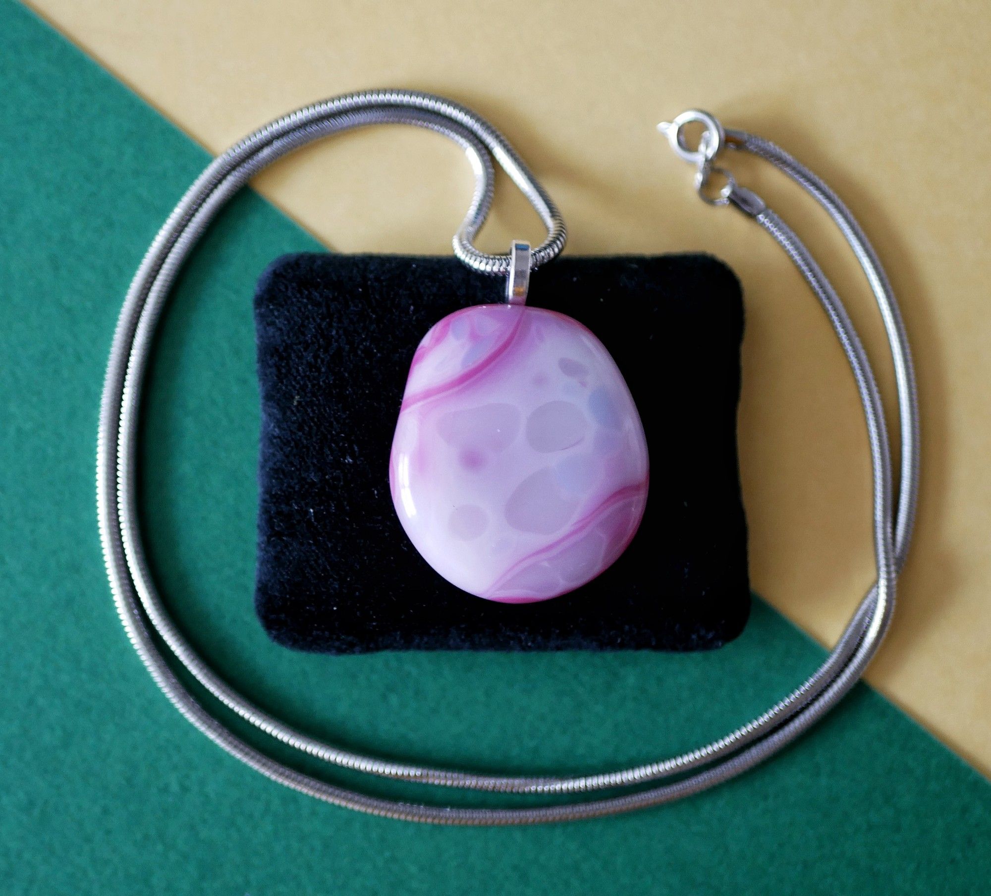 pink pendant with blotches of lighter colors on top, they look like ectoplasm to me