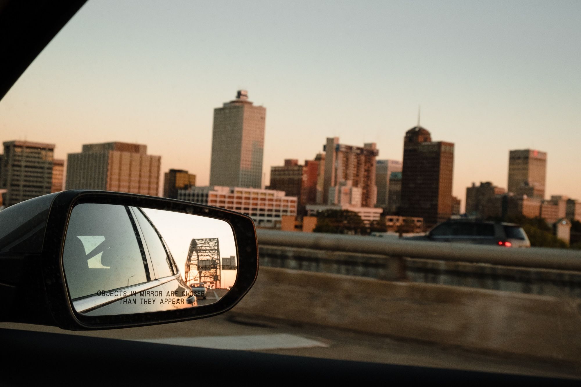 The Memphis skyline with the Hernando de Soto Bridge visible in the rear view mirror.