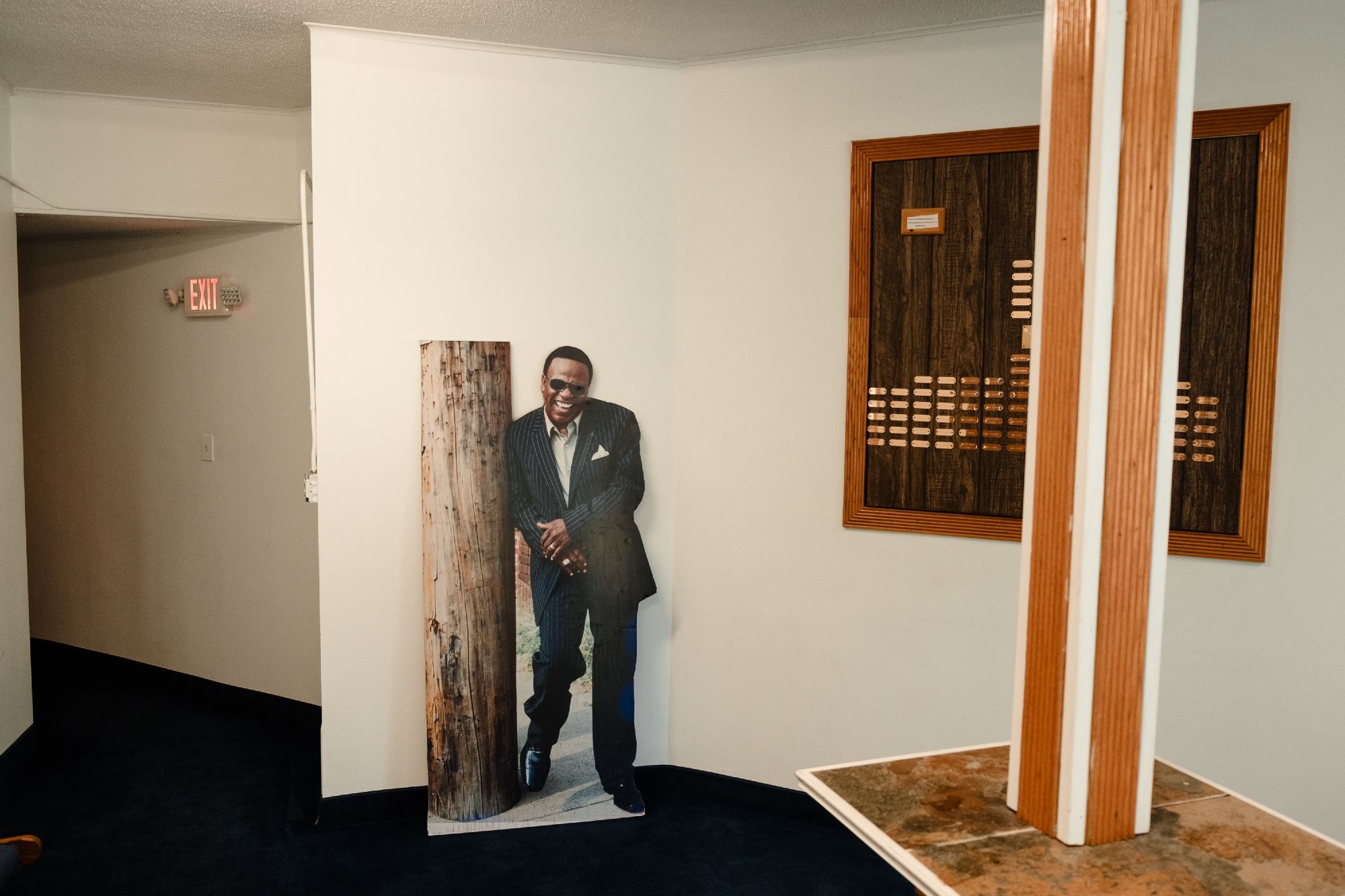 The lobby of Full Gospel Tabernacle with a cardboard cutout of Al Green in sunglasses.