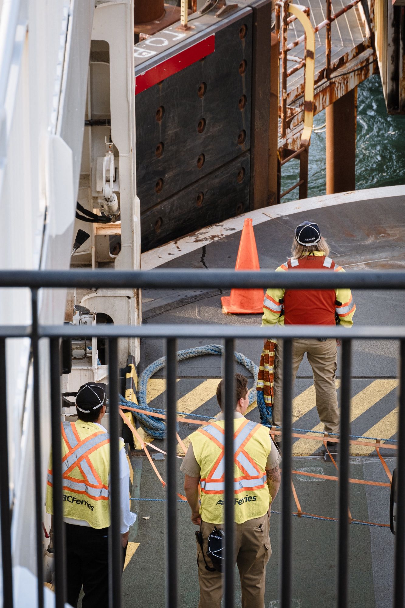 Crew standby as the ship docks.