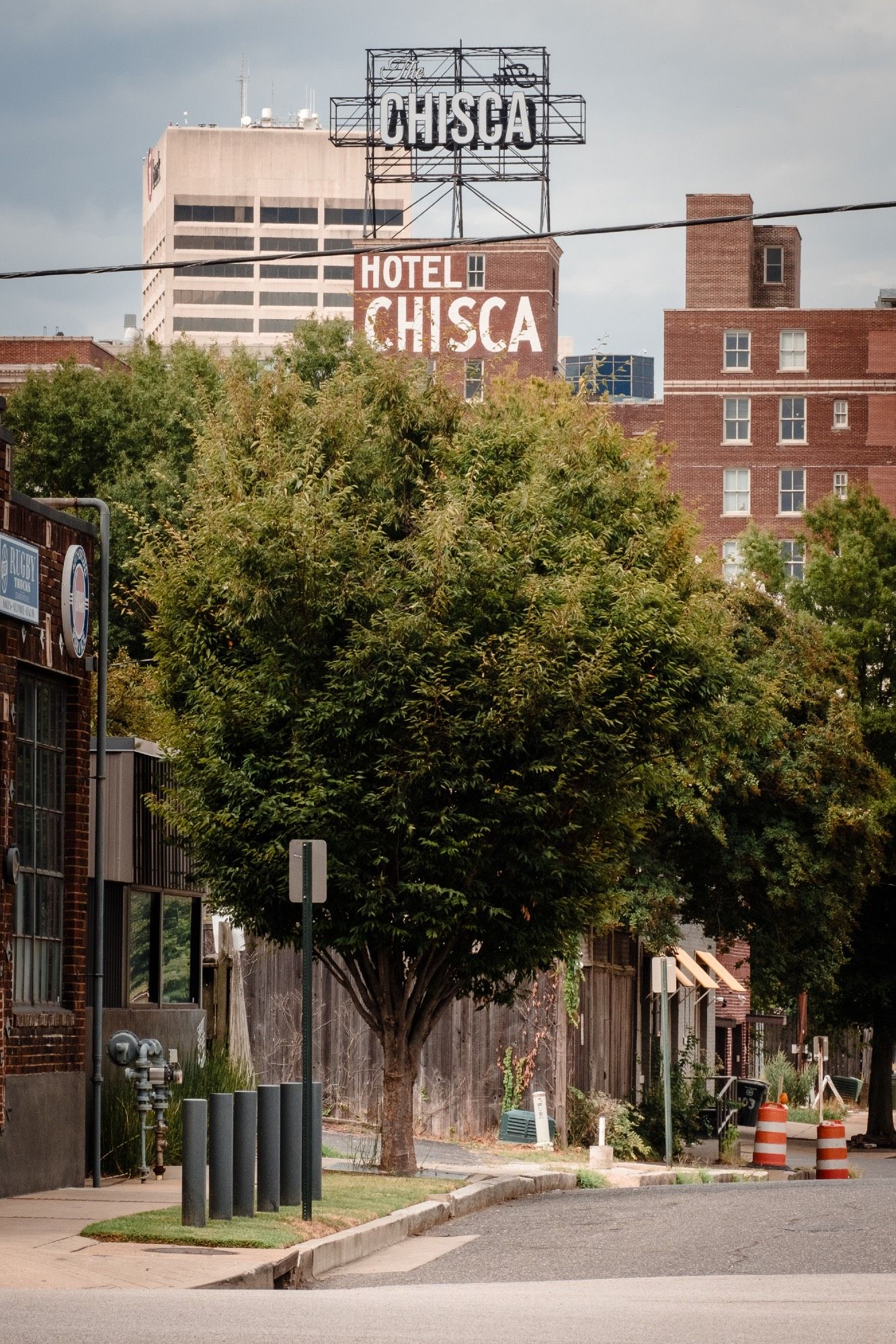 The Hotel Chisca sign looms above the skyline and a modest street scene.