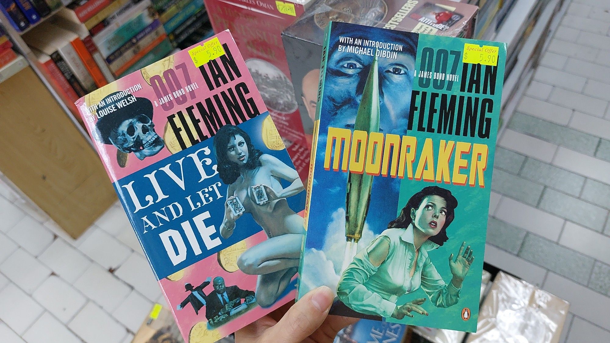 "Moonraked" and "Live and Let Die" by Ian Fleming. Classic covers.