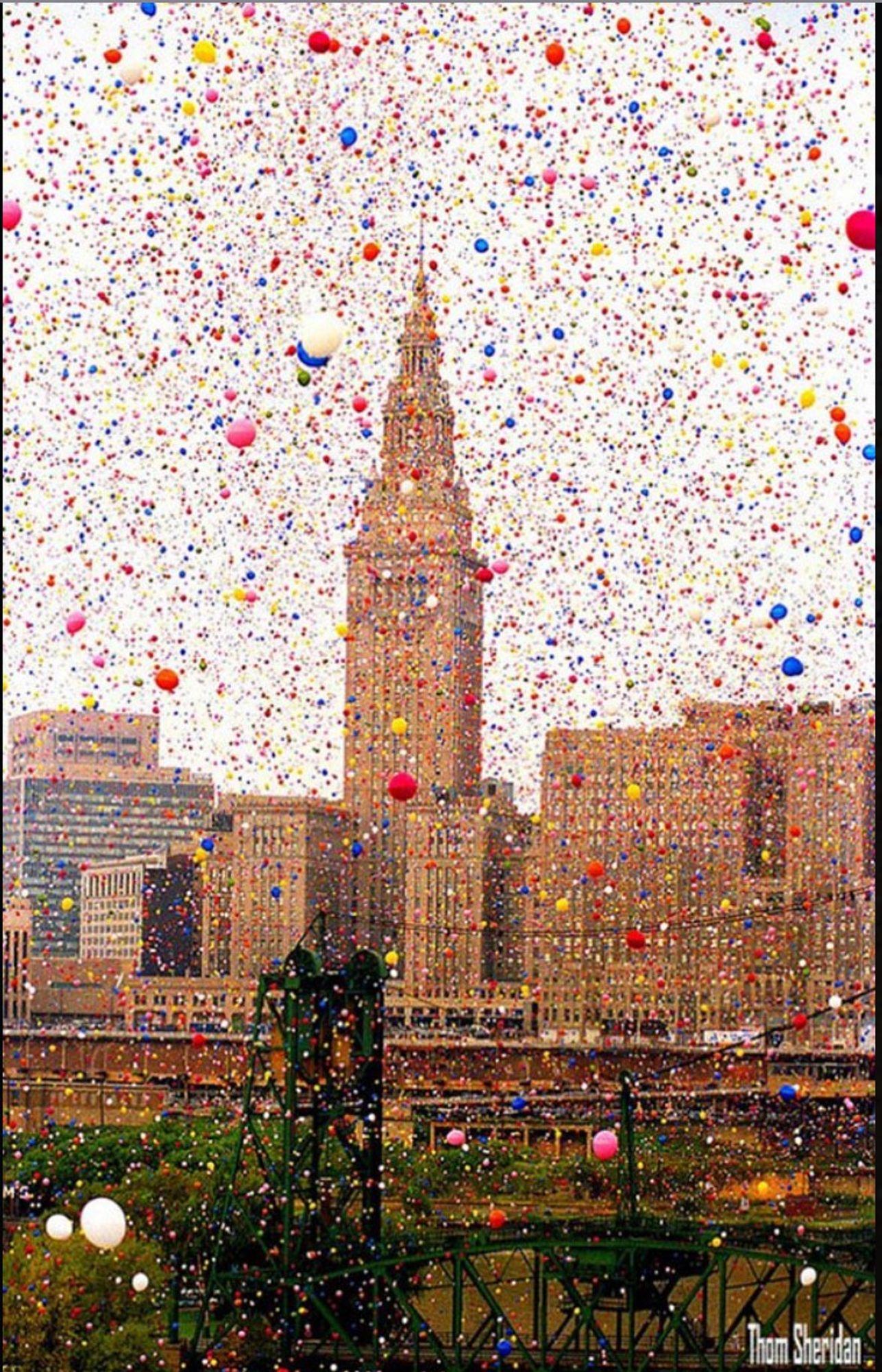 Cityscape with zillions of balloons in the air.