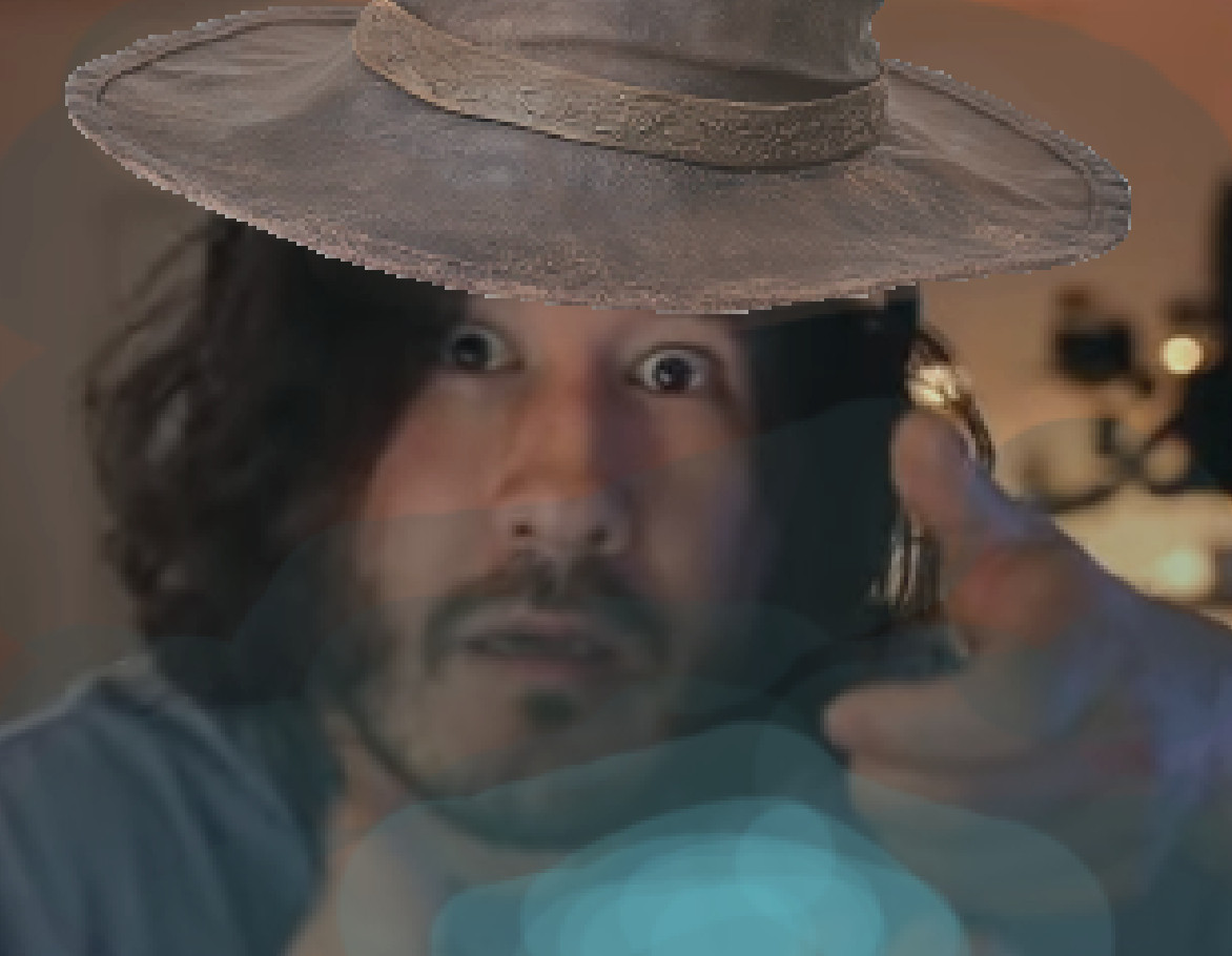 An image of Markiplier altered to look like a wizard that is firing off a magic missile.