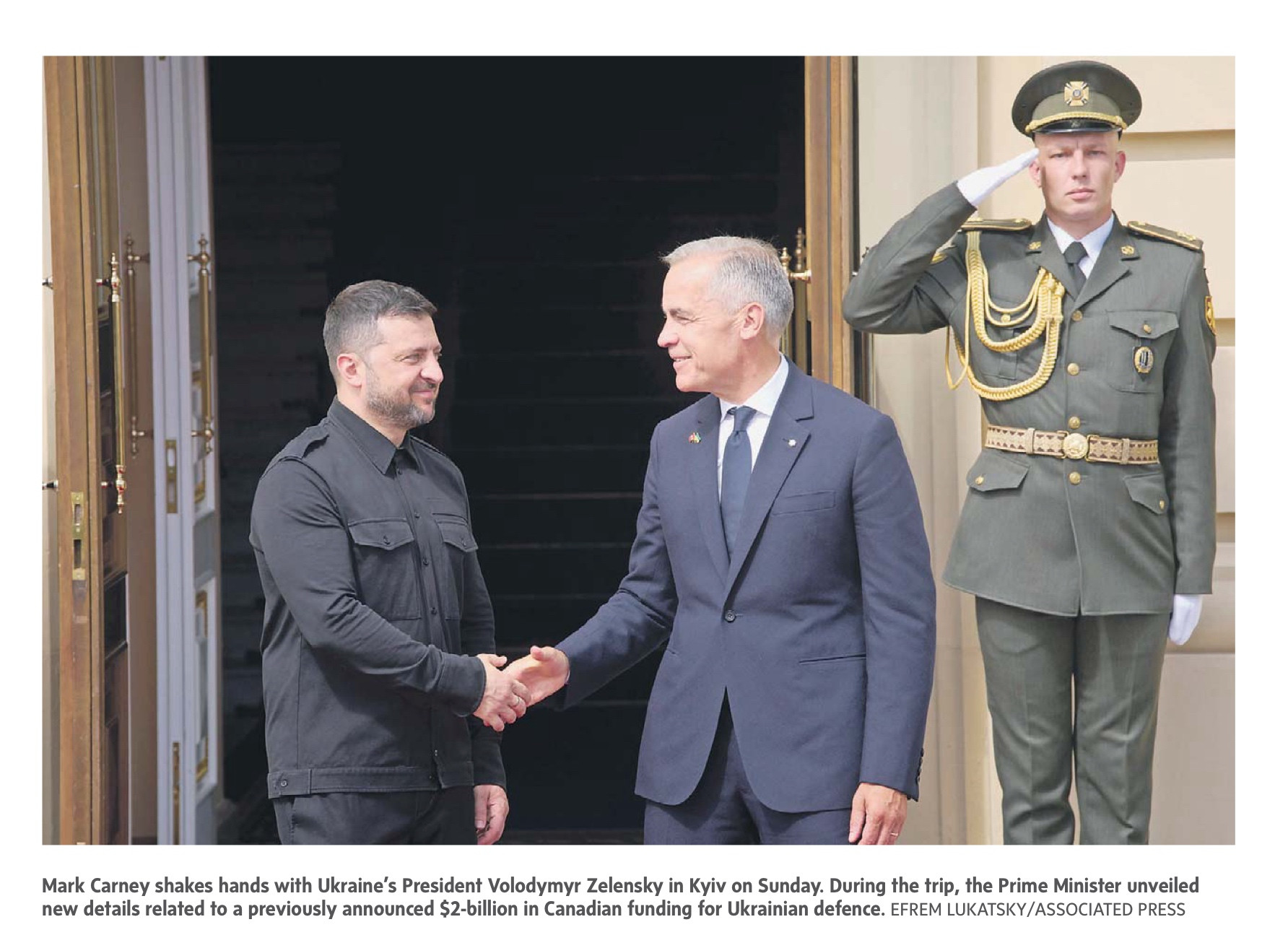 Prime Minister Carney shakes hands with President Zelensky in Kiev.